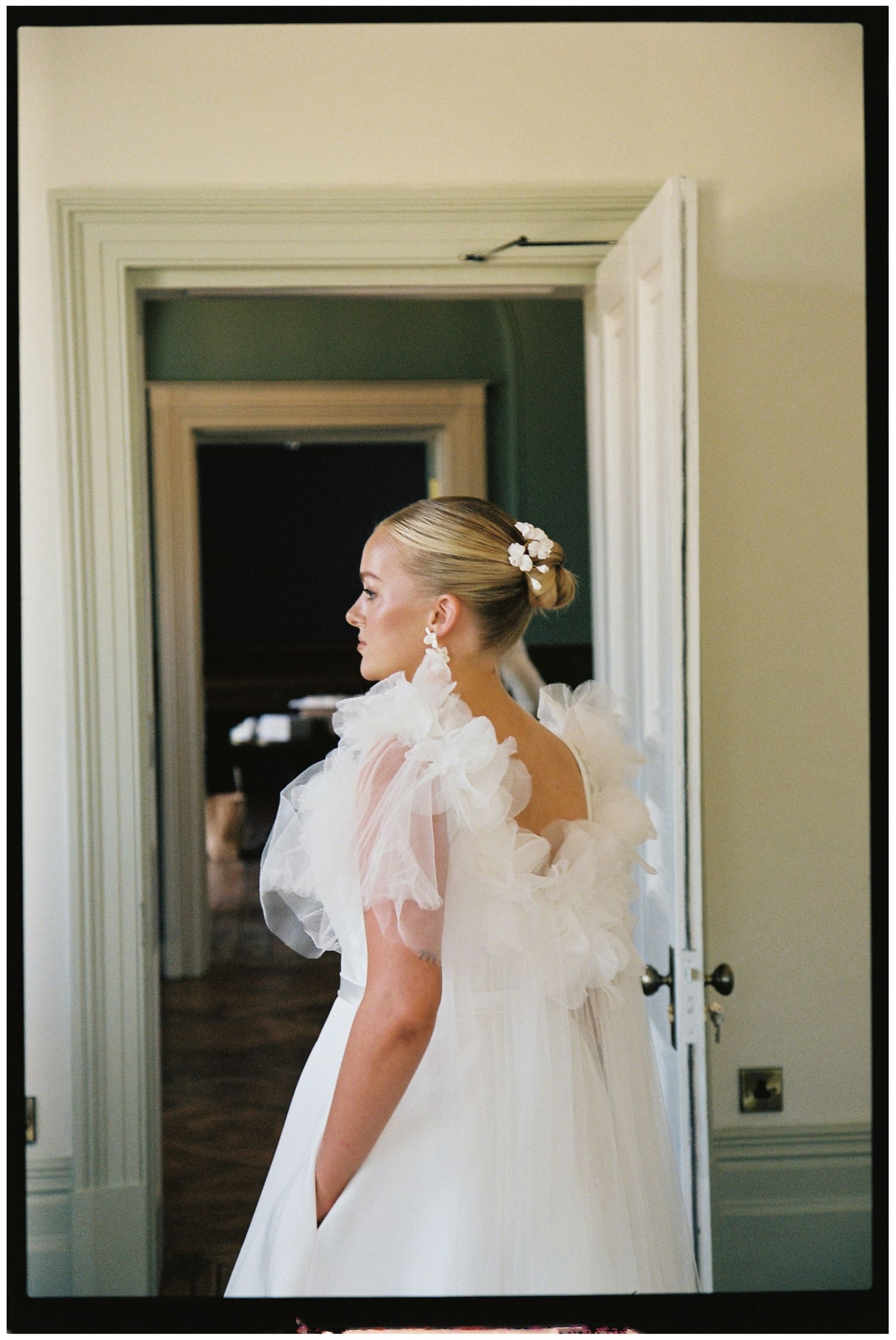 A quiet moment of the bride before the ceremony on 35mm film. Henlade House