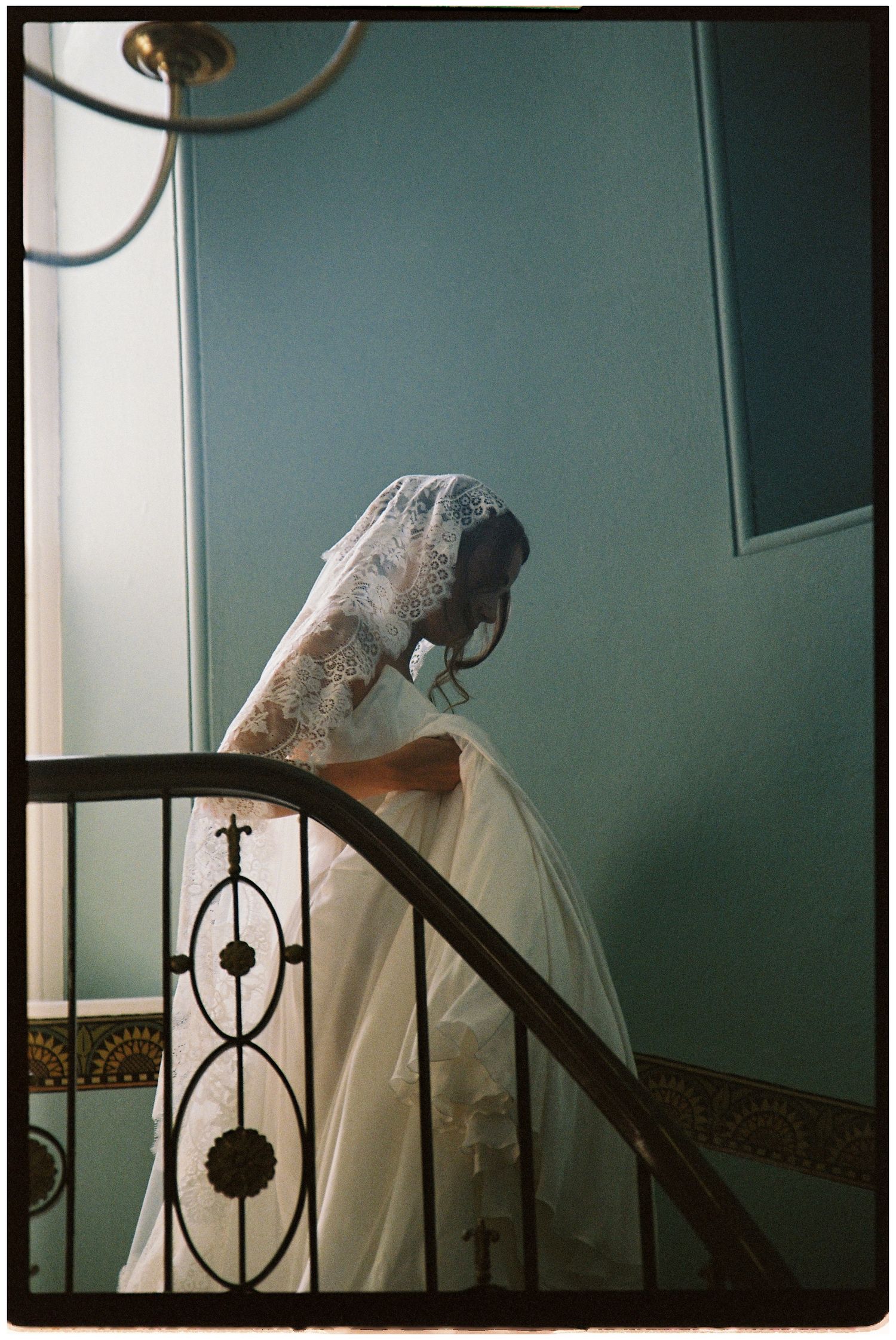 Bride walking down the stairs at Henlade House on 35mm film