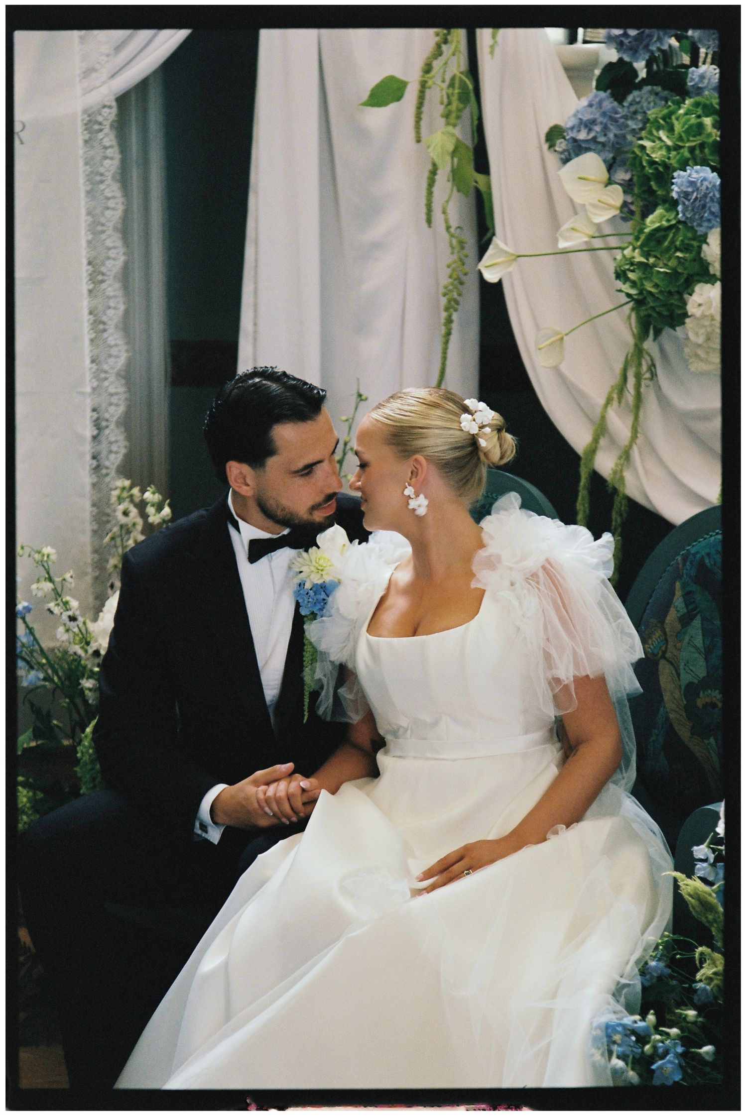 Bride and Groom kissing under the stairs at Henlade House on 35mm film.