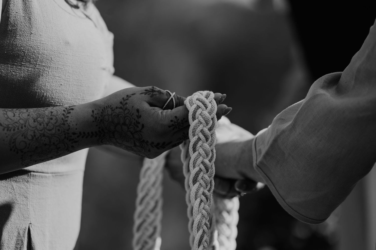 Close-up of braided details on formal attire.