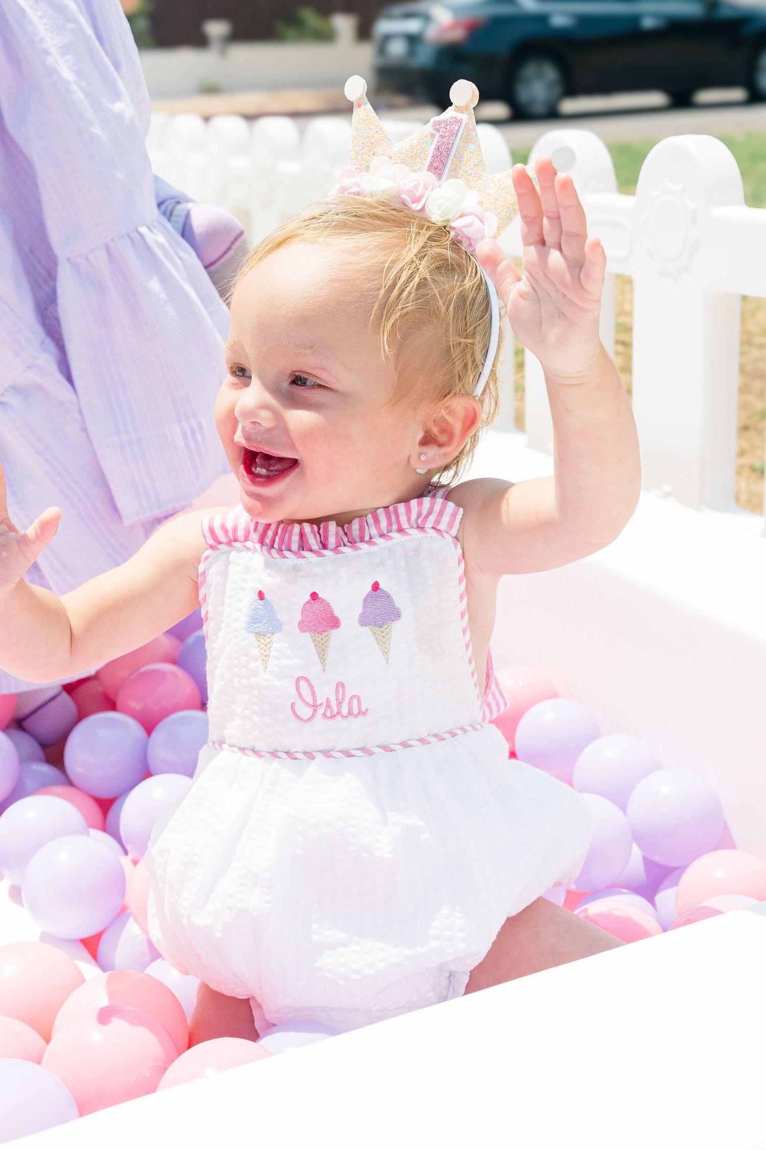 Pink party decorations including tulle and pastel balloons create a dreamy birthday celebration atmosphere.