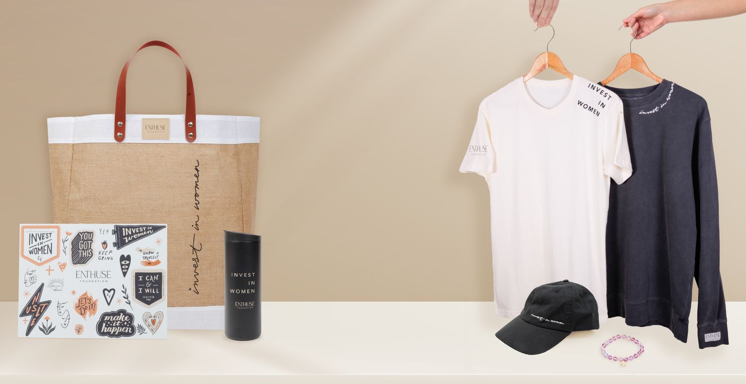 Product display of clothing items, accessories, and shopping bag against beige background.