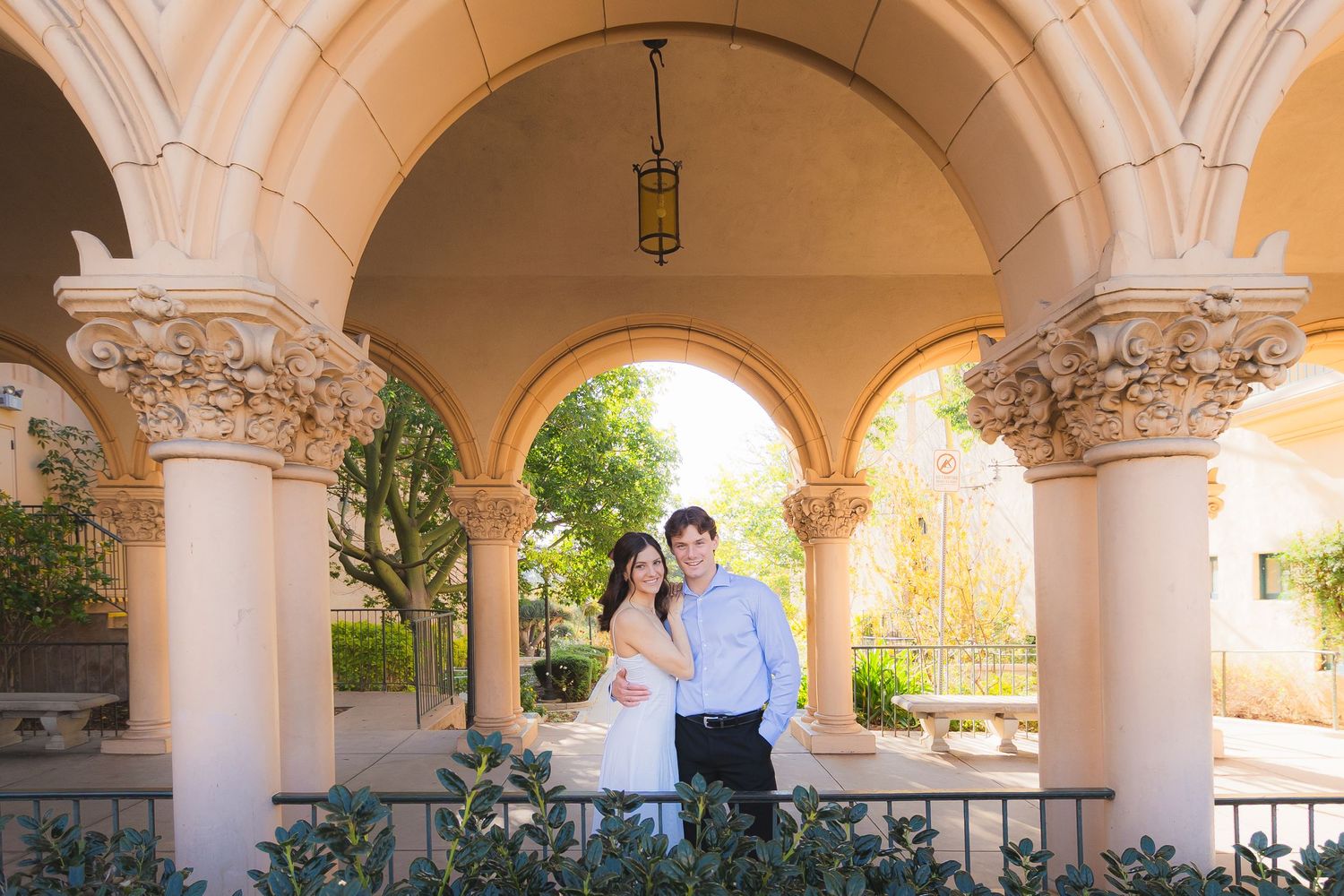 A series of elegant arched columns and walkways in a Mediterranean-style architecture with warm lighting and ornate details.