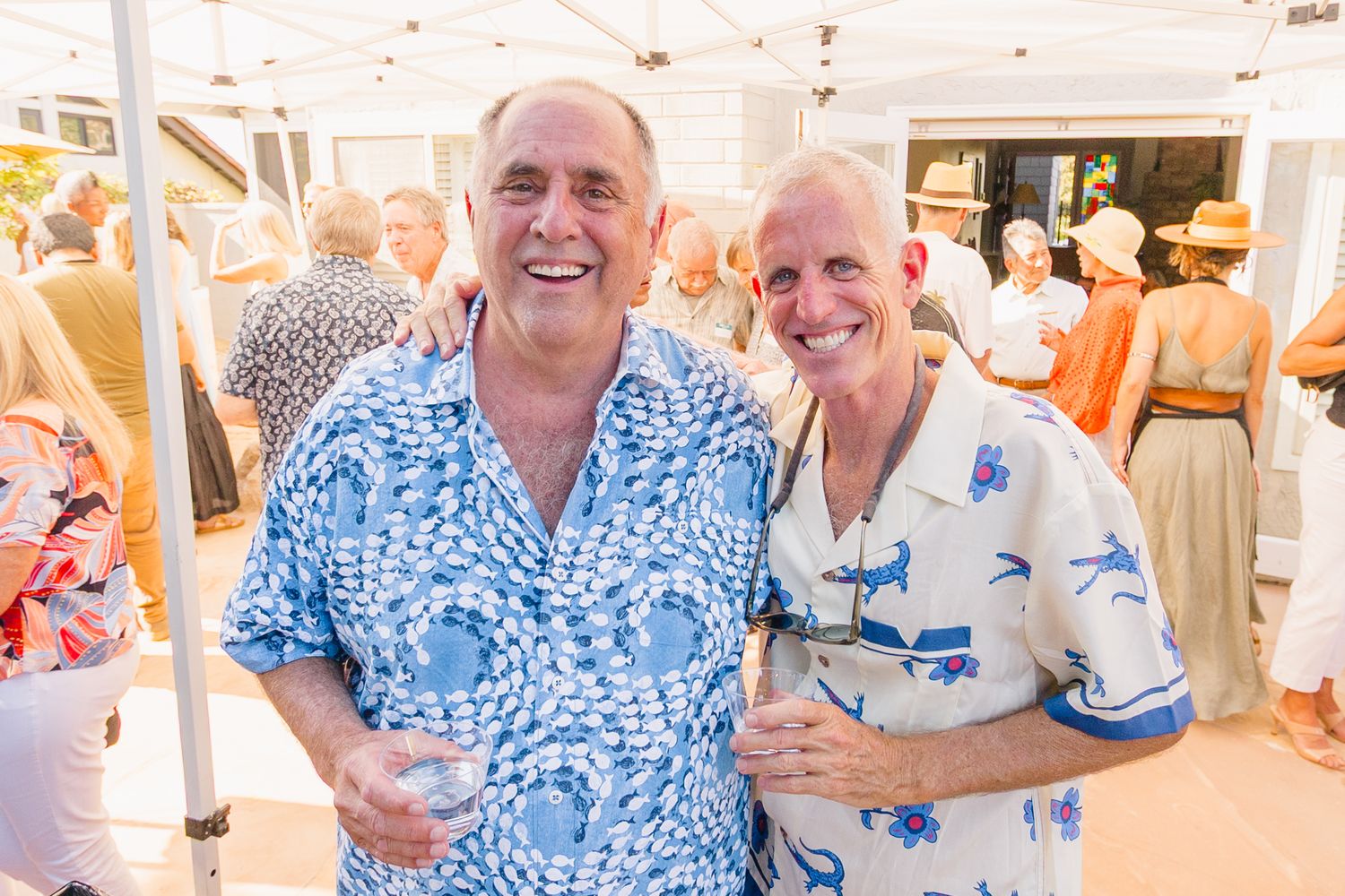 Guests enjoying refreshments at a casual outdoor celebration.