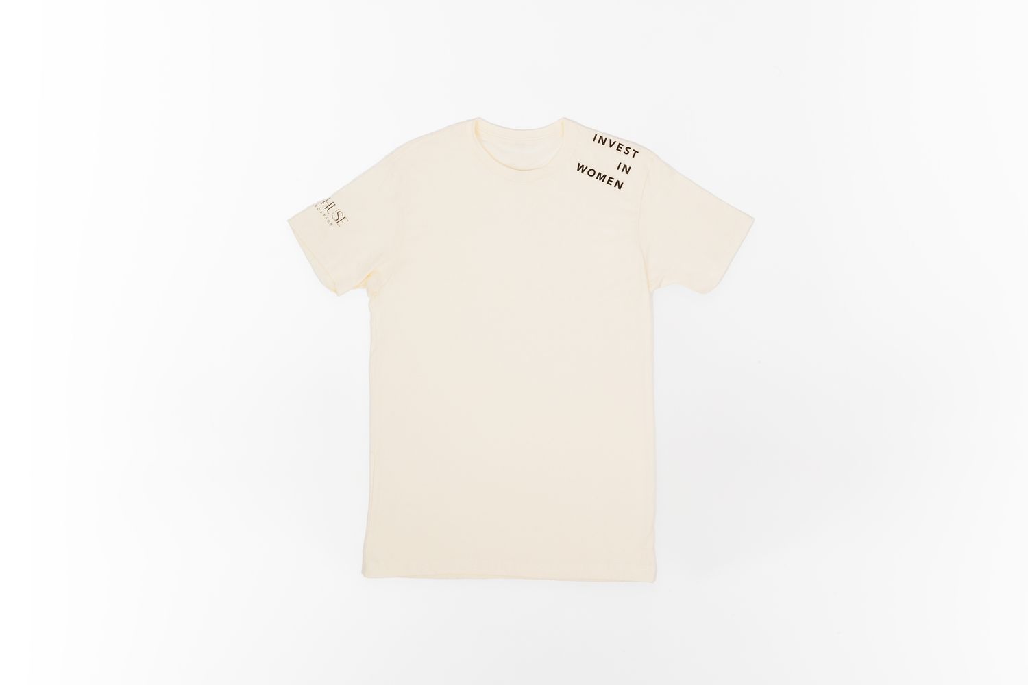 Minimal cream colored t-shirt laid flat against white background.