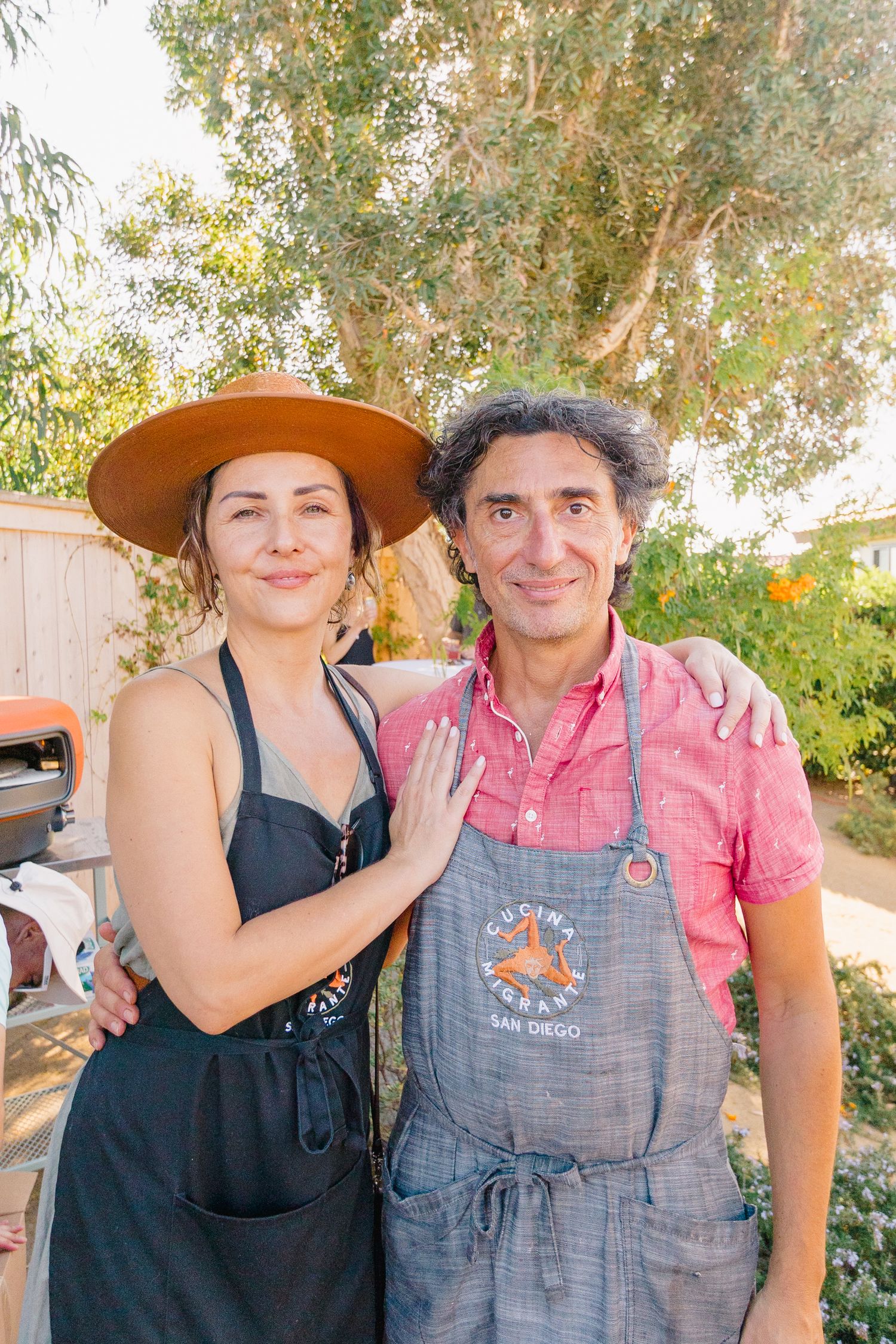 Casual outdoor party portraits taken under a shady tree on a sunny day.