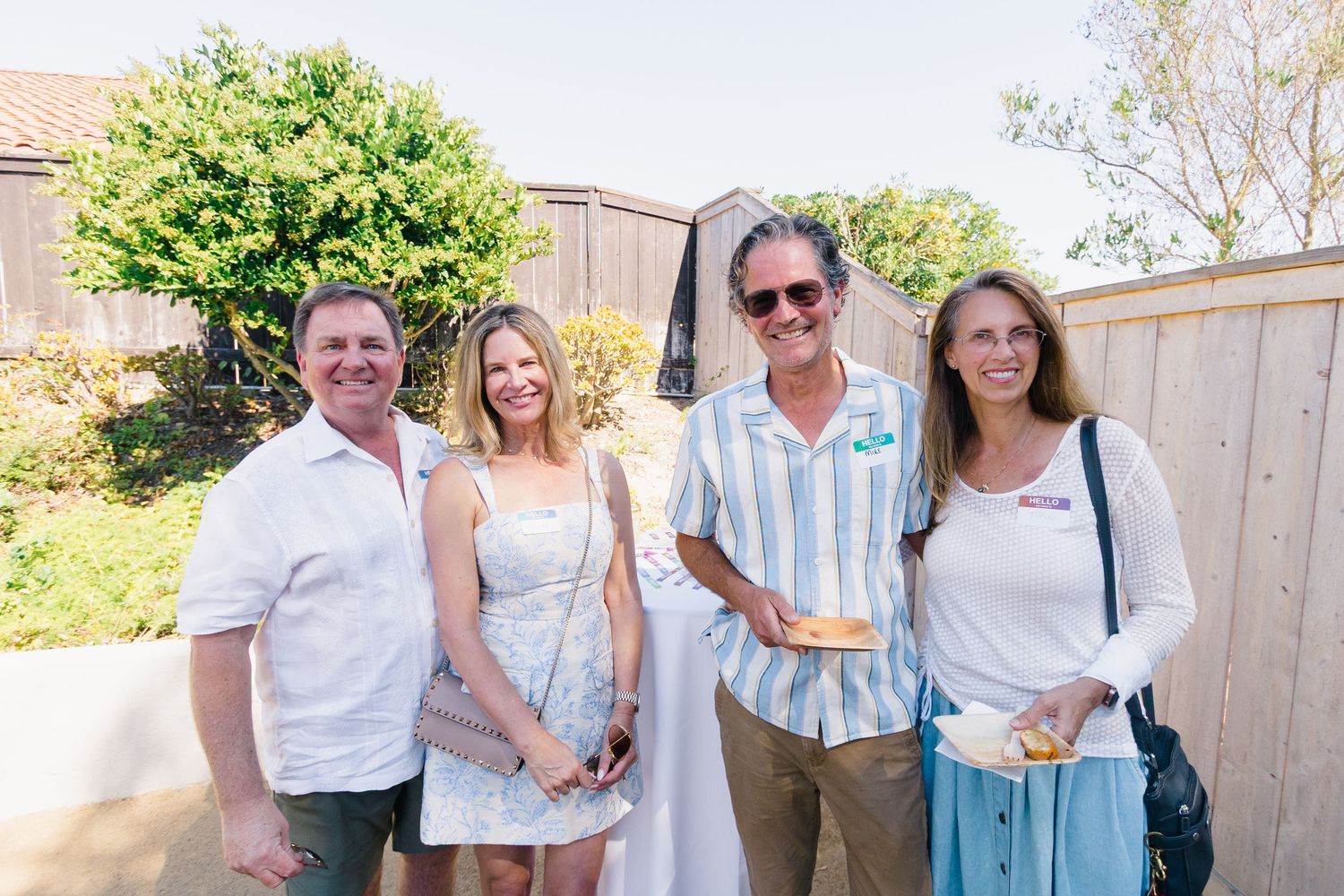 Friends gathered for a summer celebration in white and blue outfits.