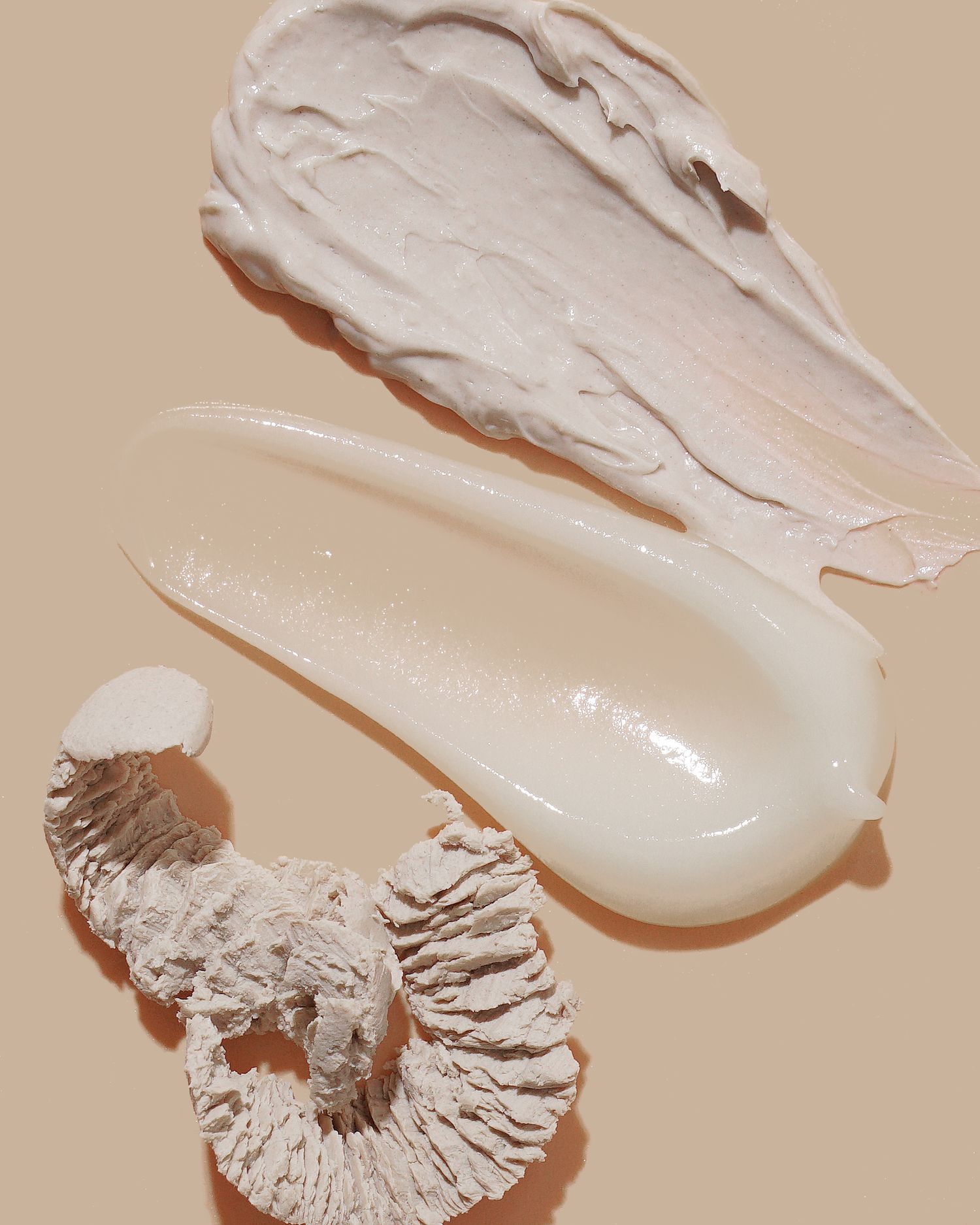 Creamy white skincare product texture swatches with mushroom ingredient detail.