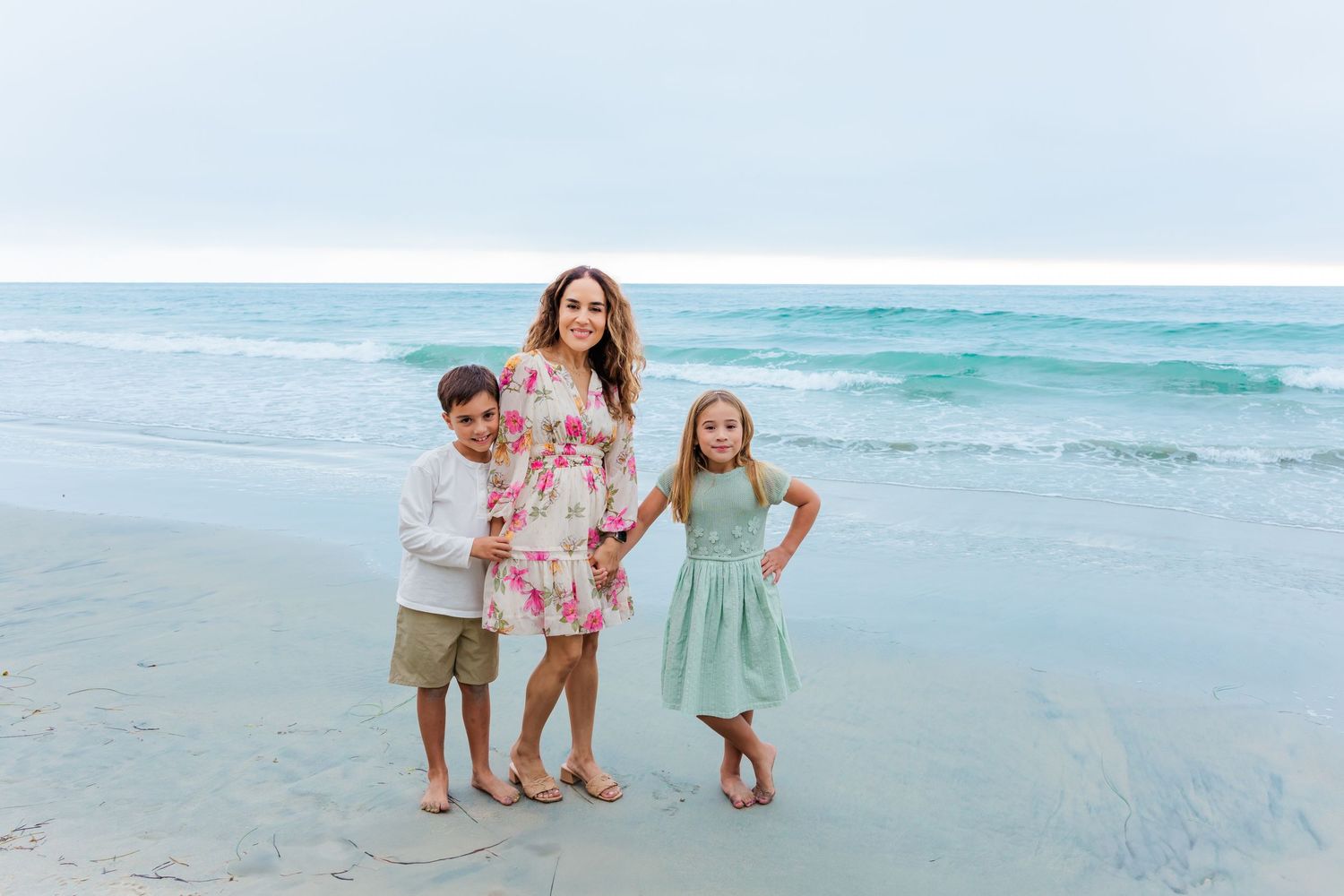 A family enjoys a fun moment together on the beach.