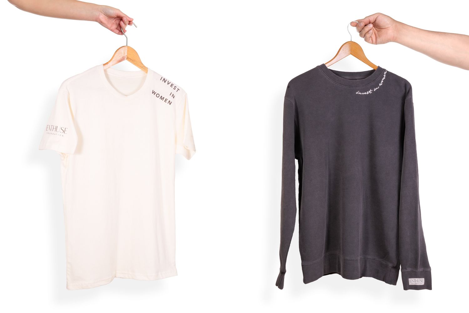 Two t-shirts in white and charcoal gray displayed on hangers.
