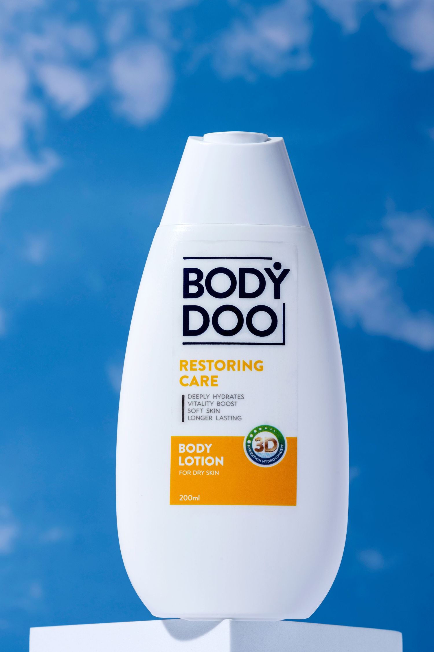 Body Doo moisturizing lotion bottle displayed against bright blue sky background.