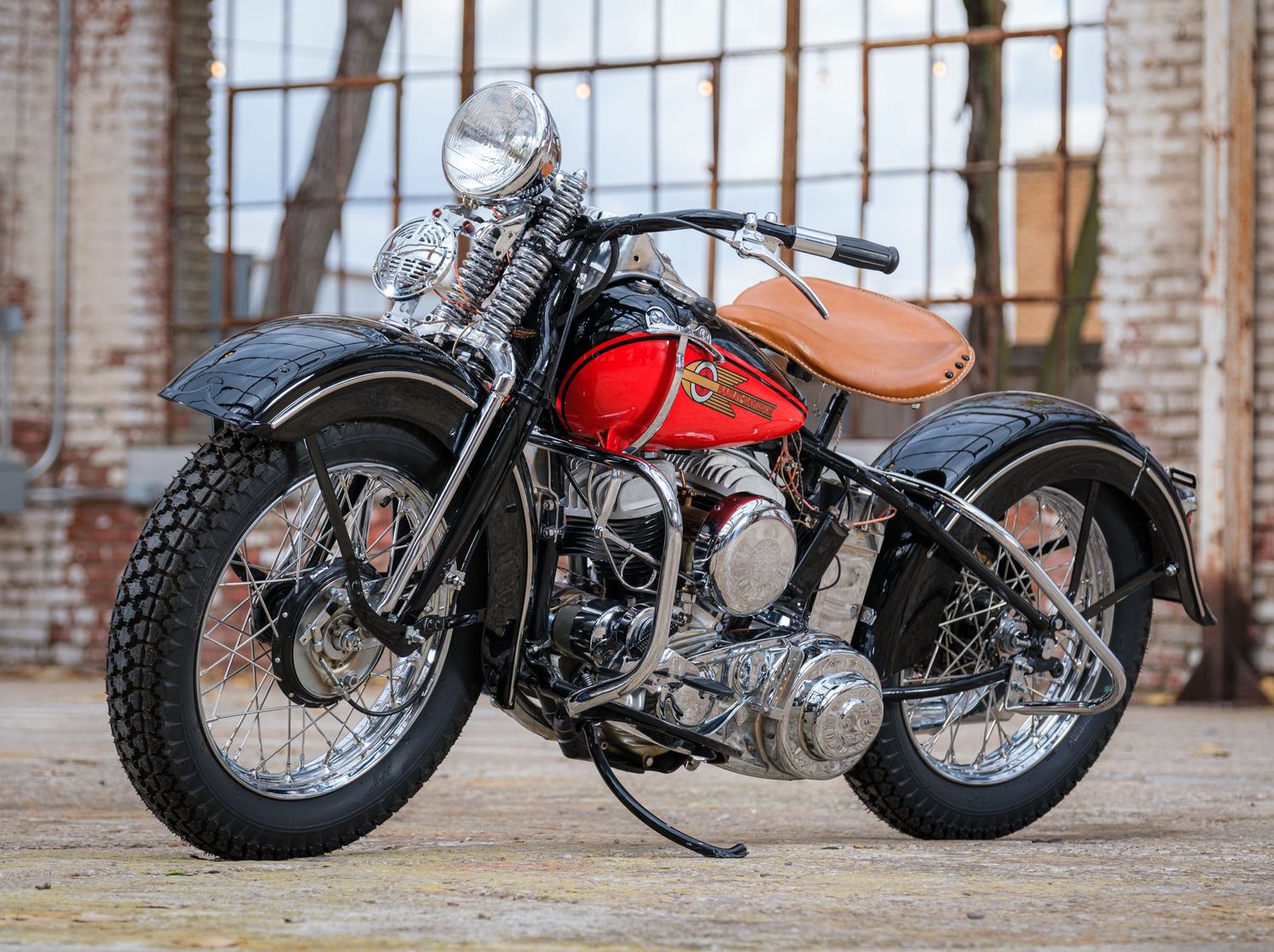 Vintage Harley-Davidson motorcycle with leather seat and classic styling.
