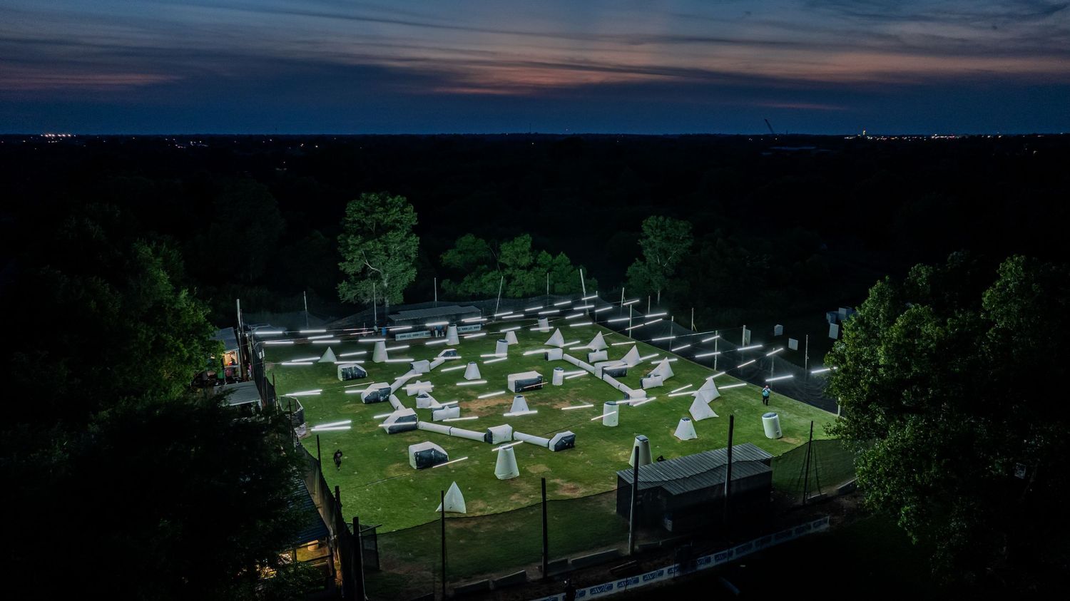 Night view of an empty motocross practice facility with strategically placed lighting system.