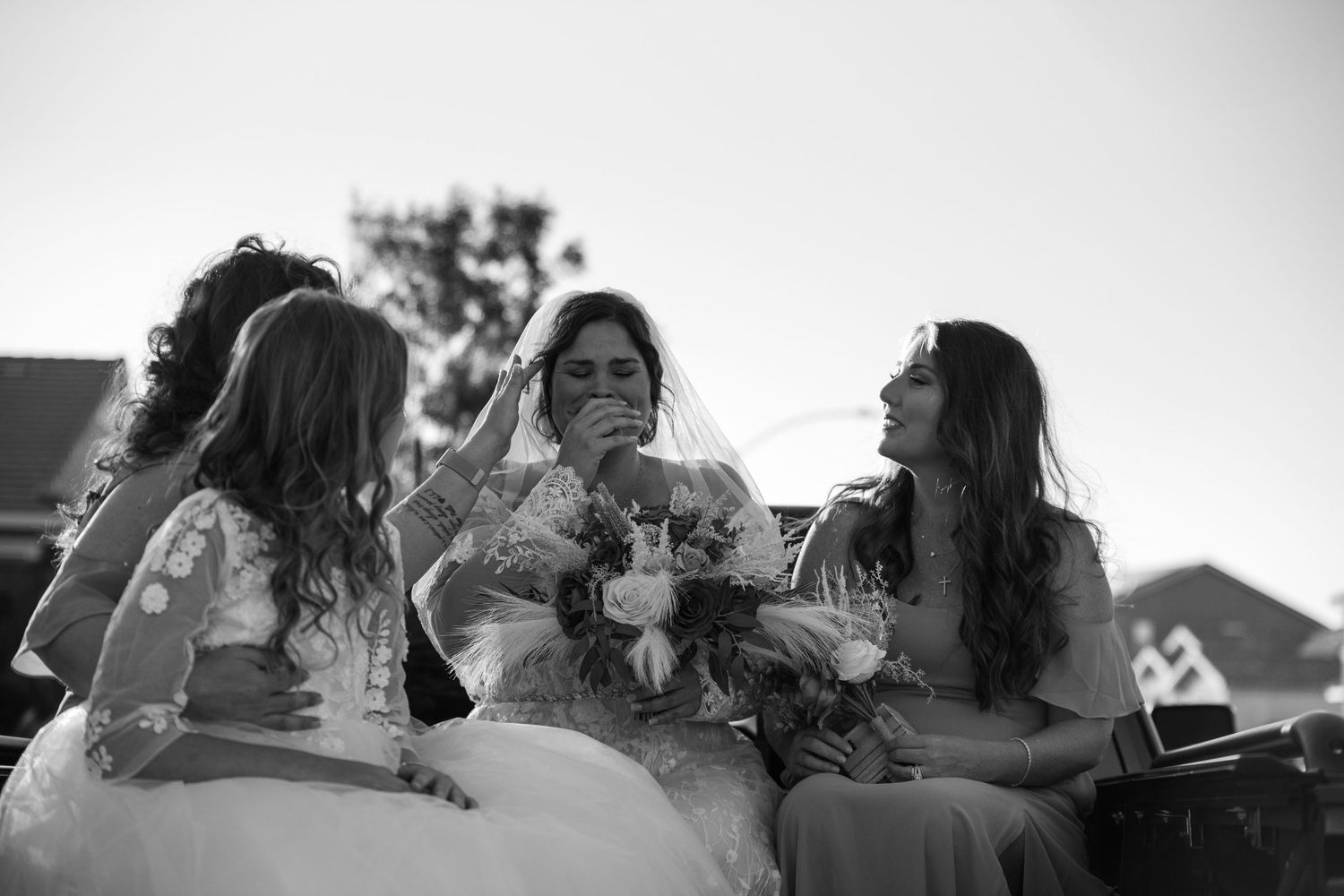 Black and white photo series showing a romantic moment between a couple in a natural setting.