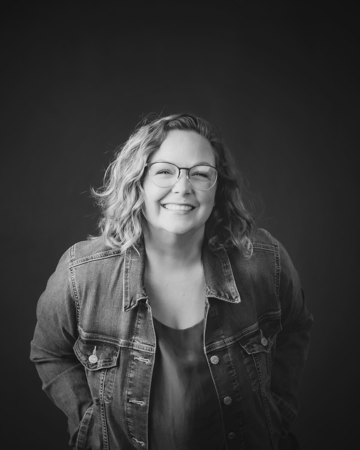 A series of black and white portraits showing joyful expressions and laughter while wearing a denim jacket.