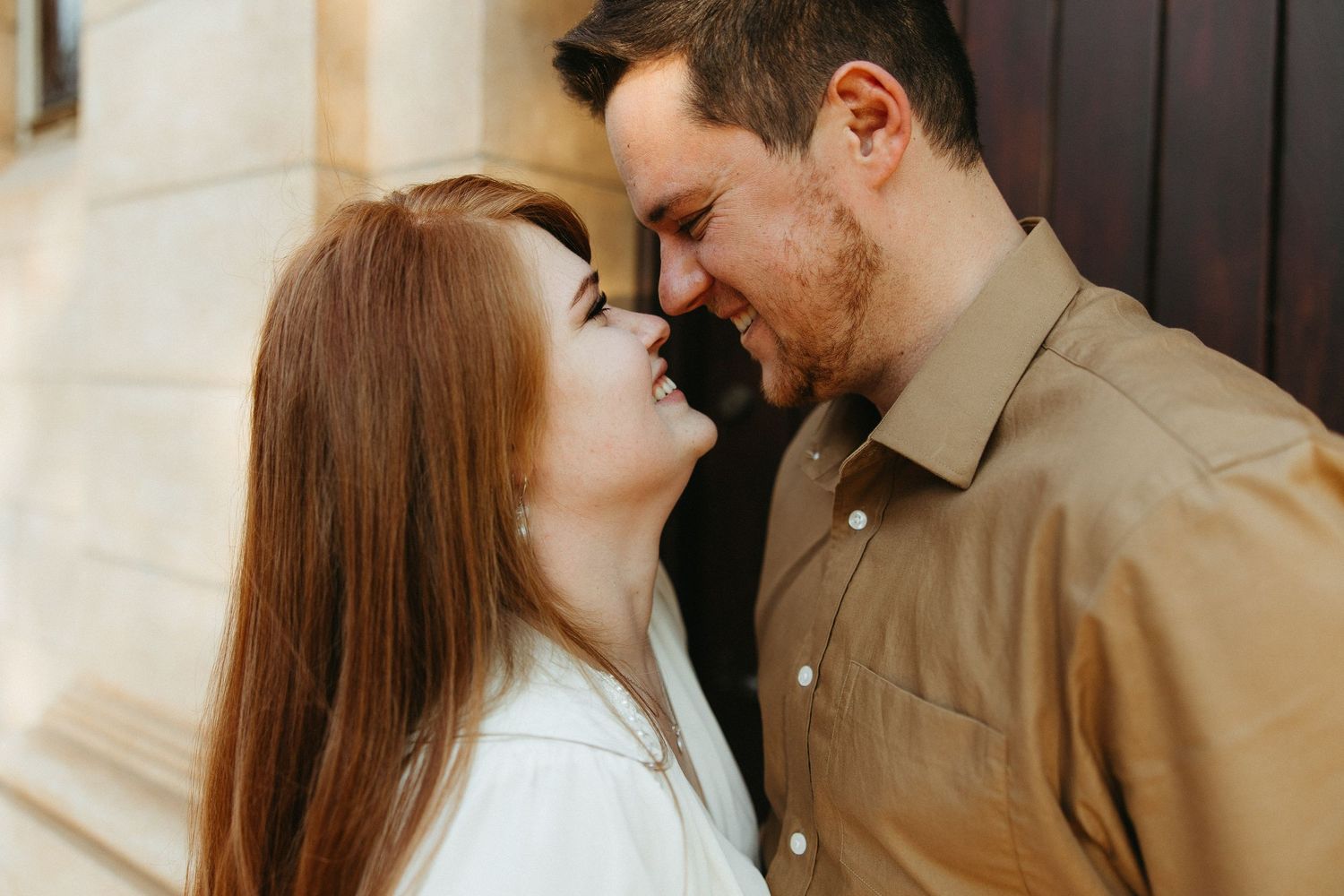 Engaged Couple smiling with their noses touching