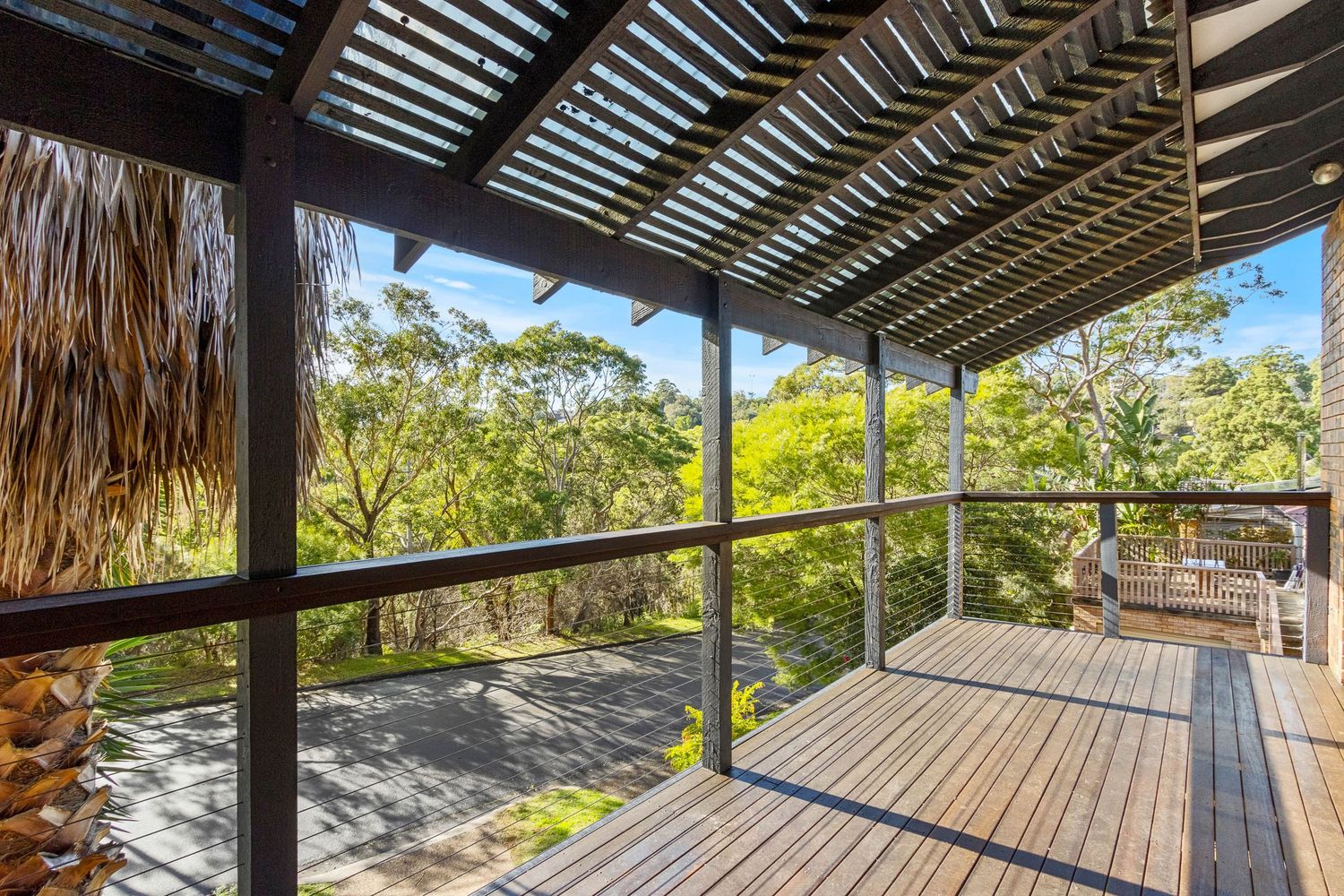 Real estate photography of a Sydney balcony with a bushland view