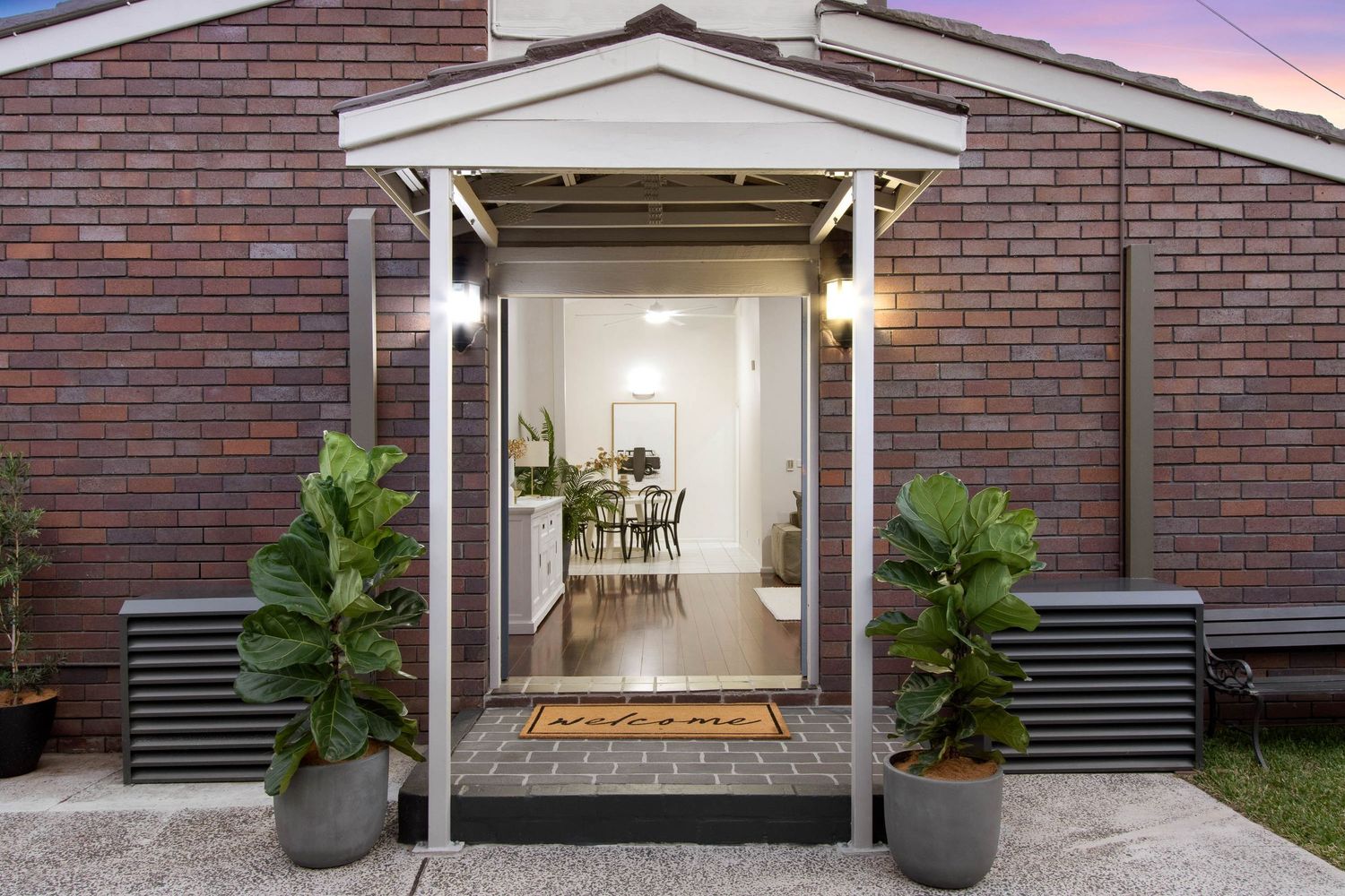 Twilight real estate photo of a home front door entry