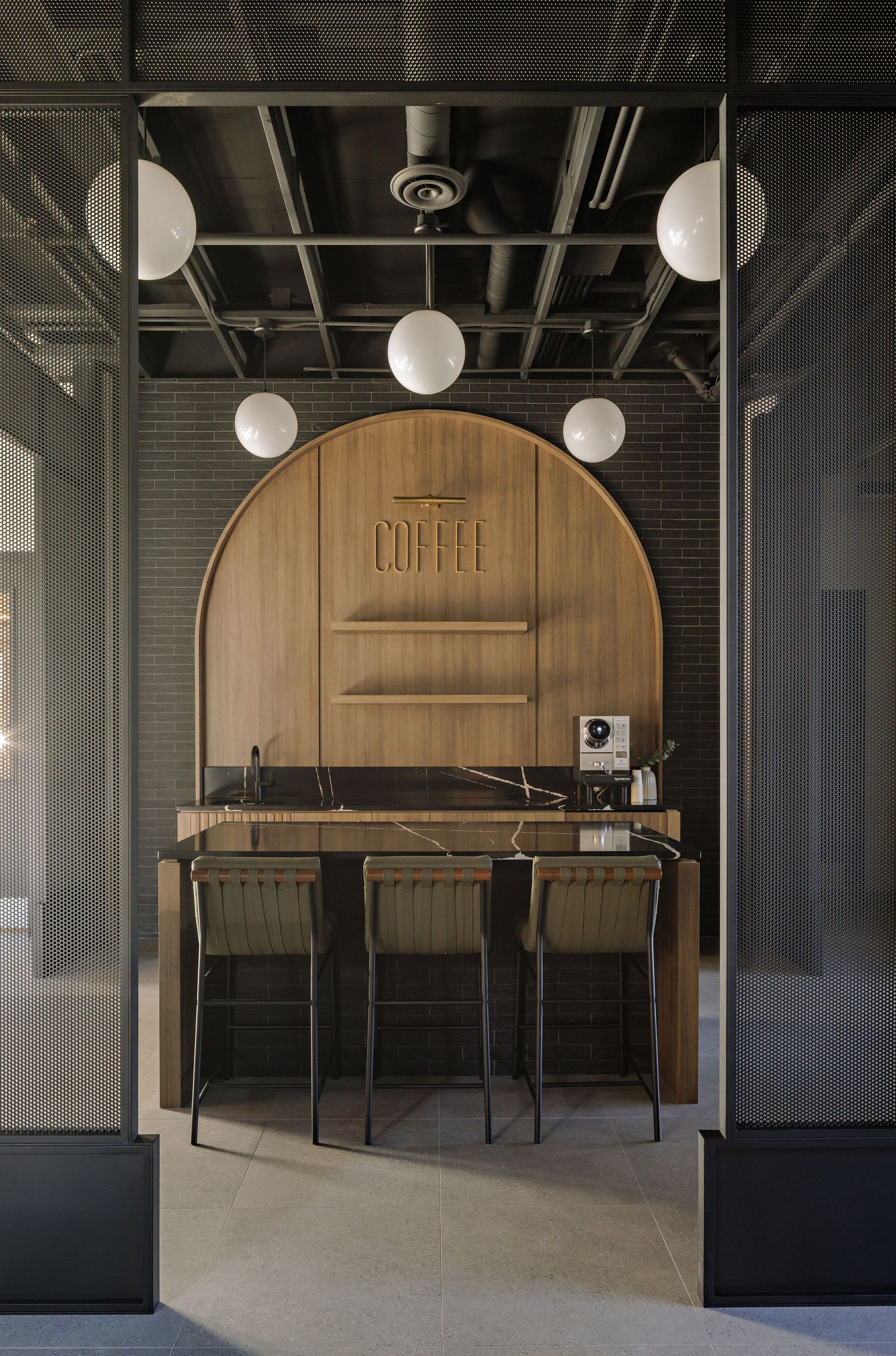 Modern industrial cafe interior with wooden arch details, black metal chairs, and pendant lighting fixtures.