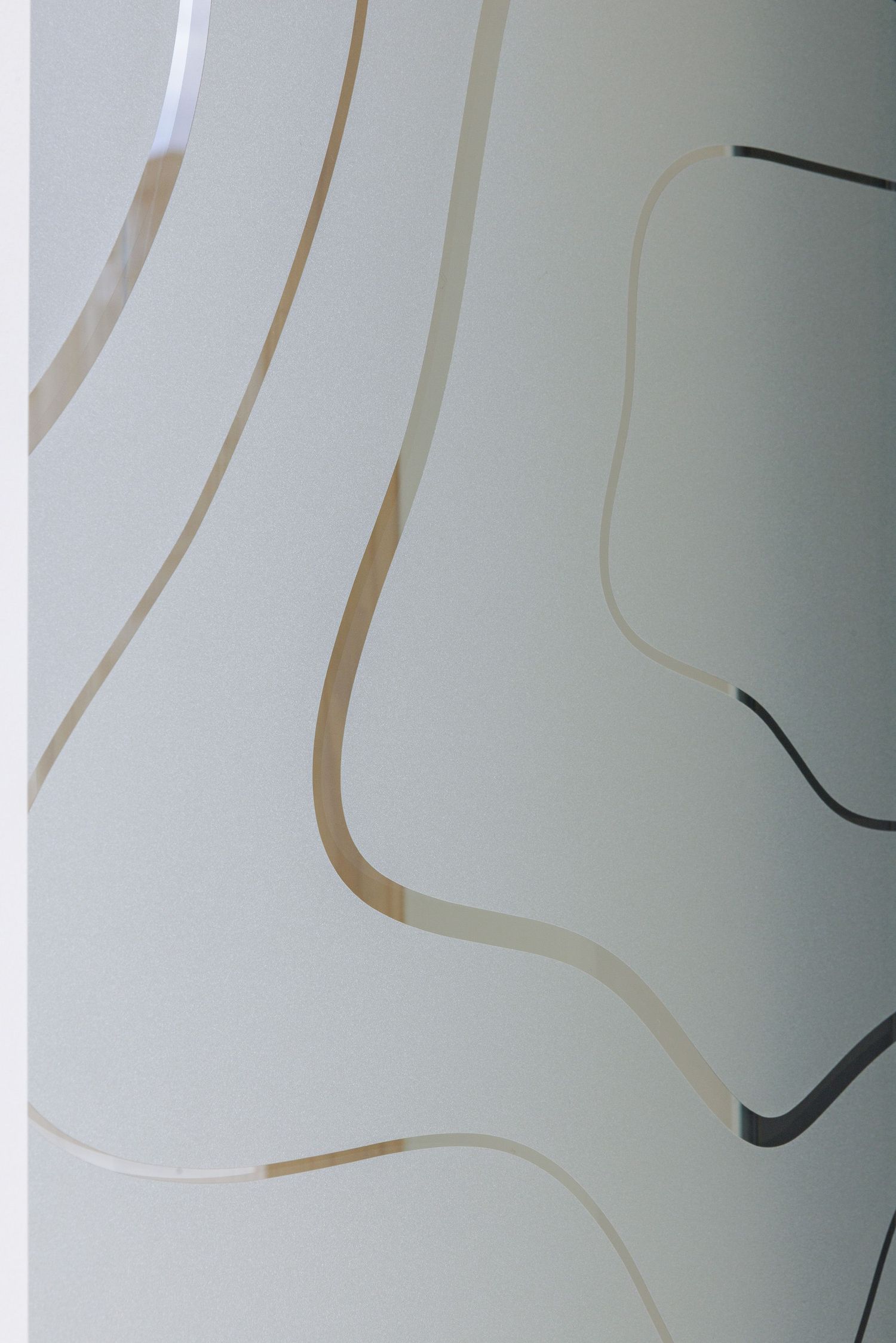Abstract art with curved brown and black lines flowing across a light grey background creating a minimalist composition.