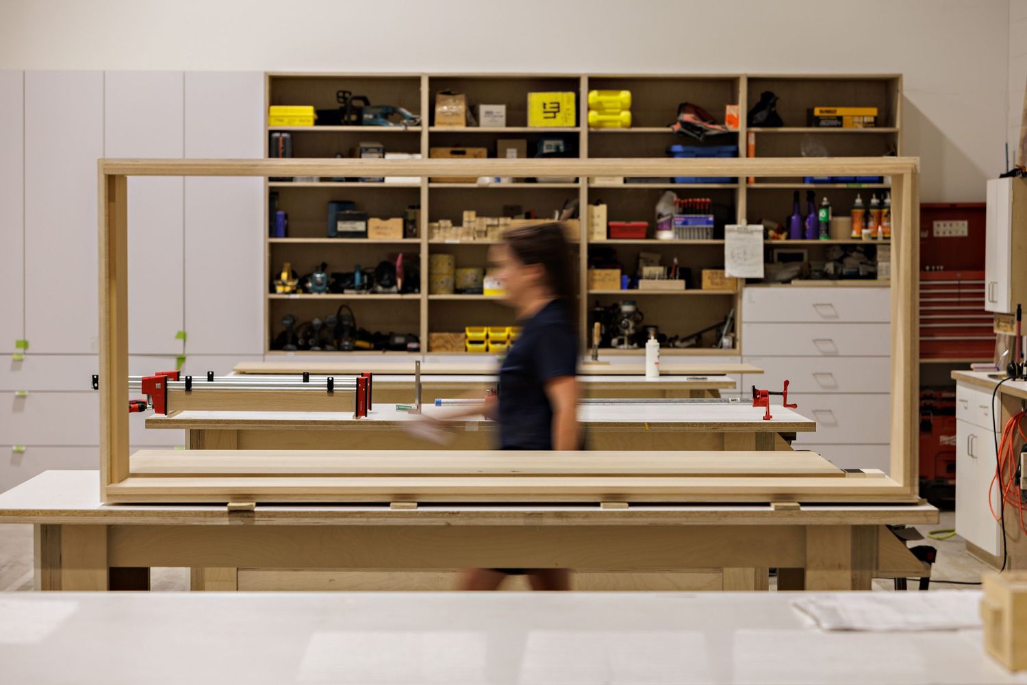 Modern retail store interior with shelving units displaying merchandise.