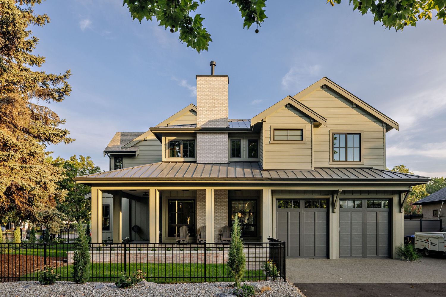 Modern farmhouse exterior with dark siding and metal roof shown from multiple angles in a panoramic collage.