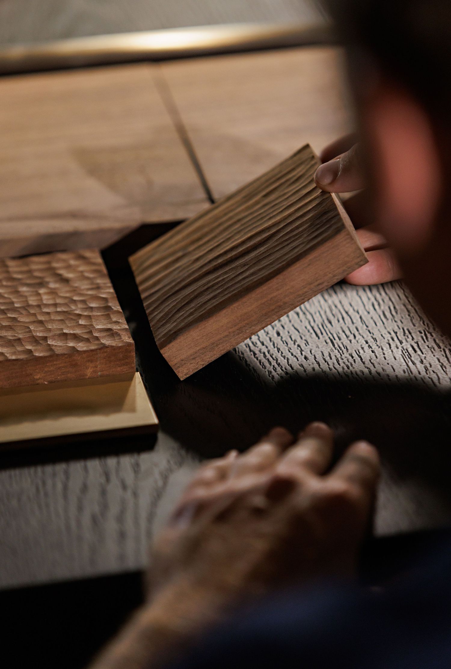 Close-up view of pages in an old book with textured paper being turned.