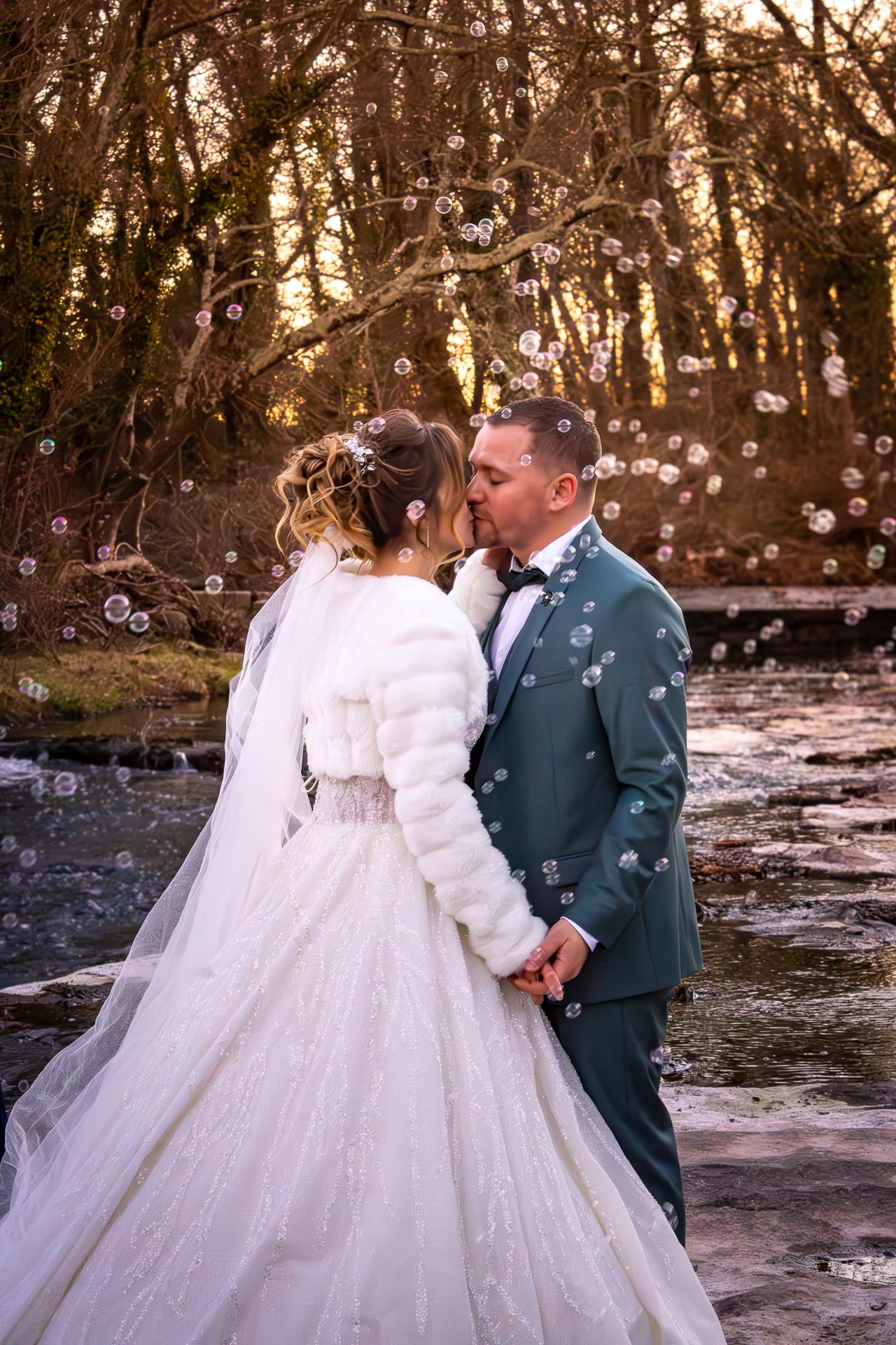 A romantic winter wedding photo sequence with bubbles floating through the air as a couple shares intimate moments.