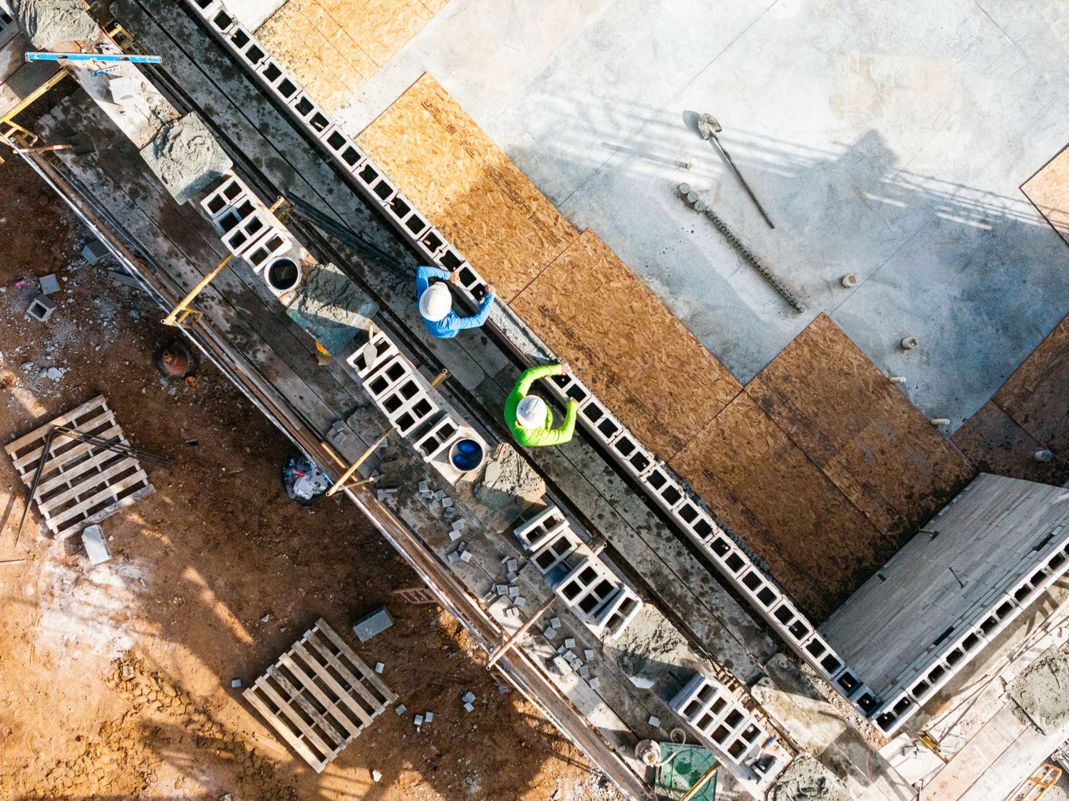 Aerial view of a construction site showing excavation work and heavy machinery in progress.
