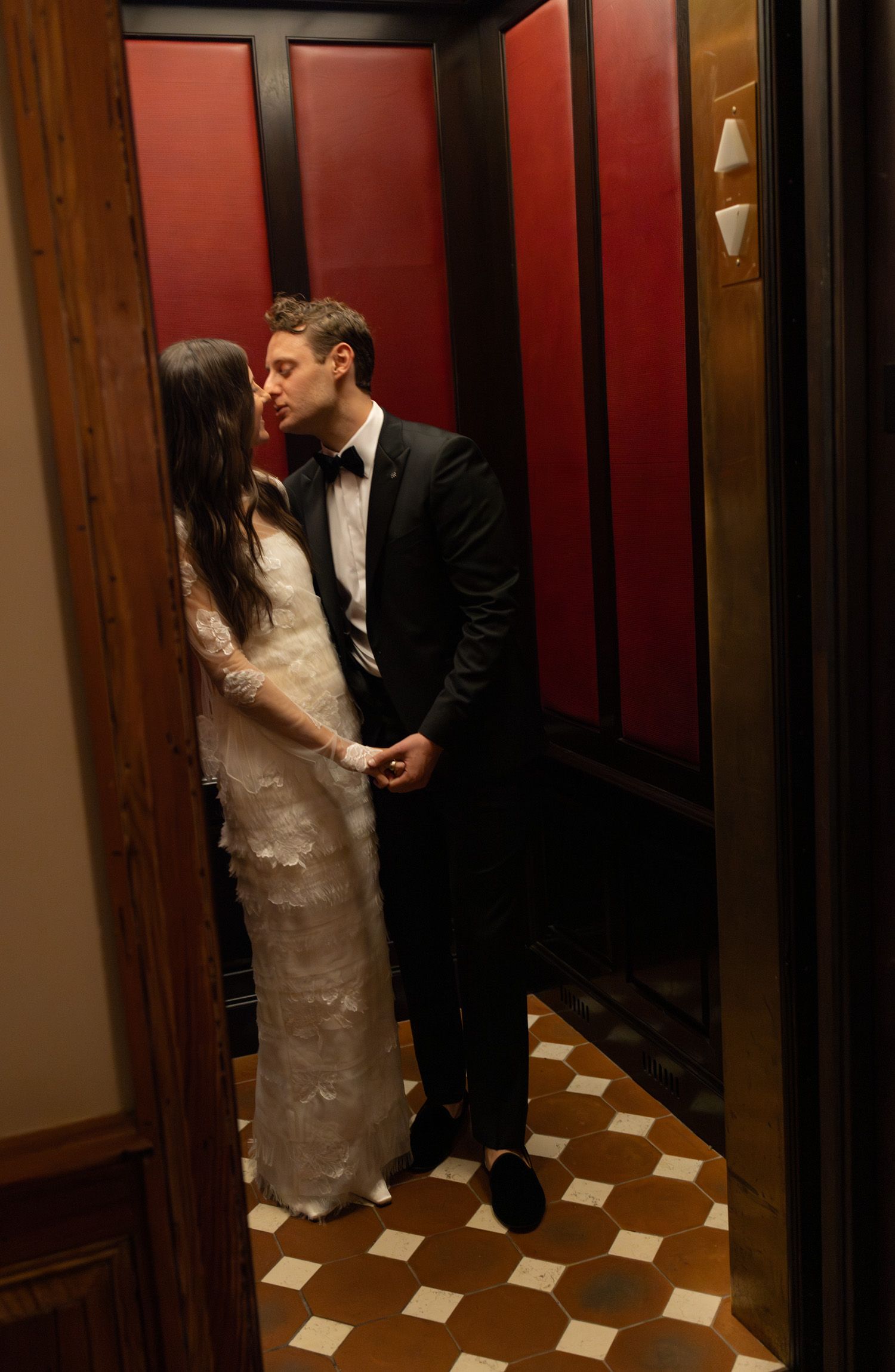 Couple kissing in an elevator in NYC
