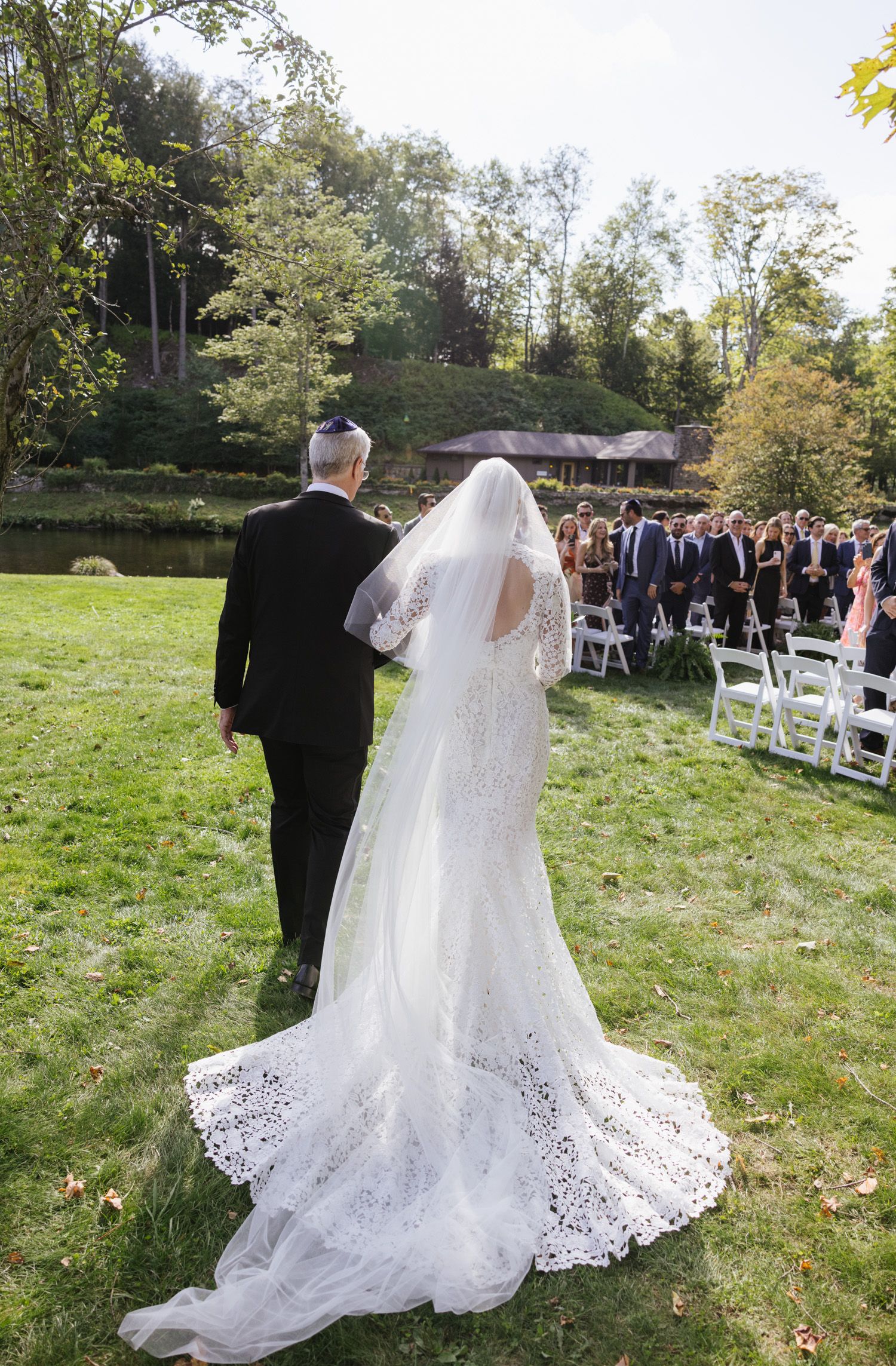 A father walking the bride down the aisle at Antrim Streamside wedding