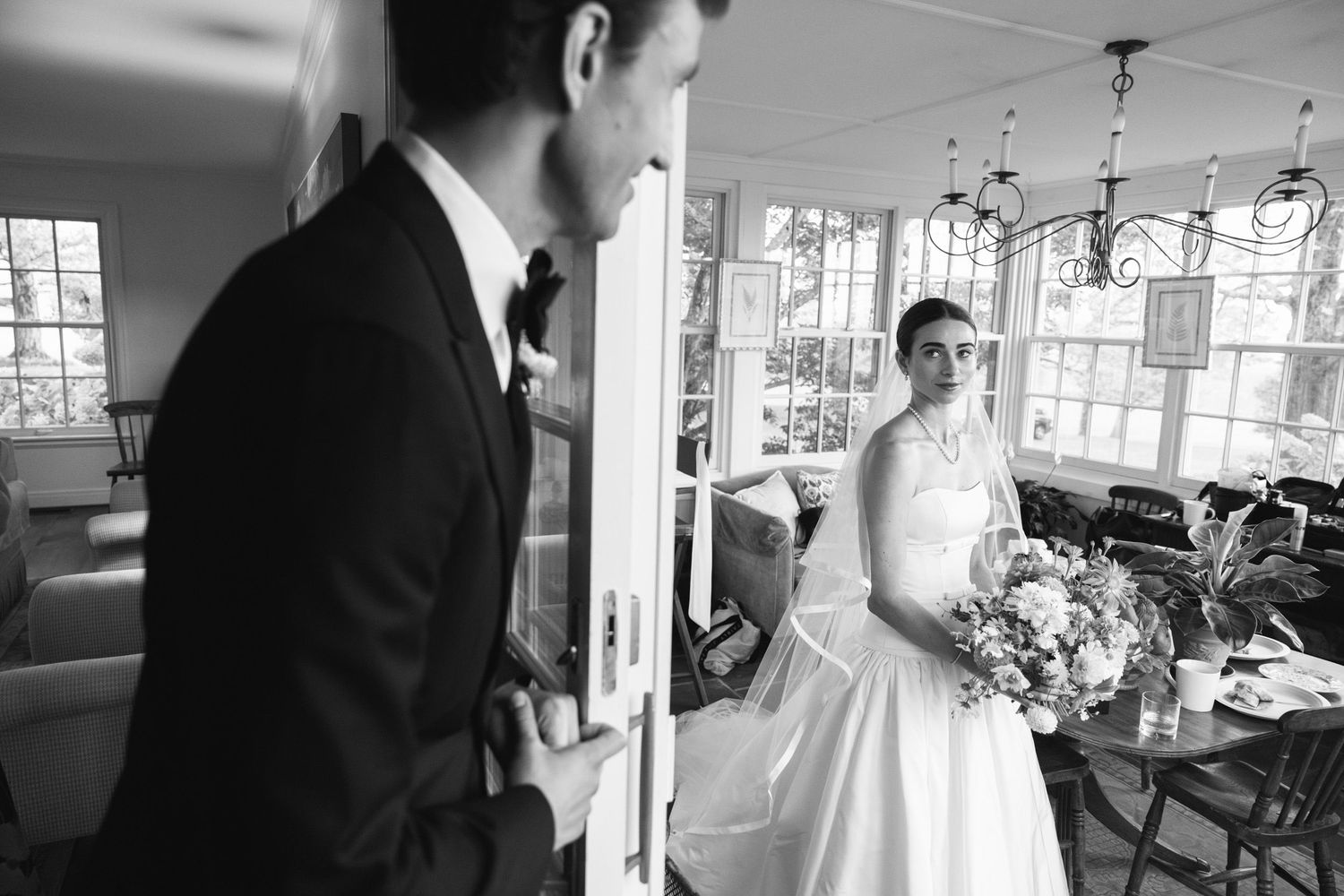 Groom looking at bride before the ceremony at LionRock Farm wedding