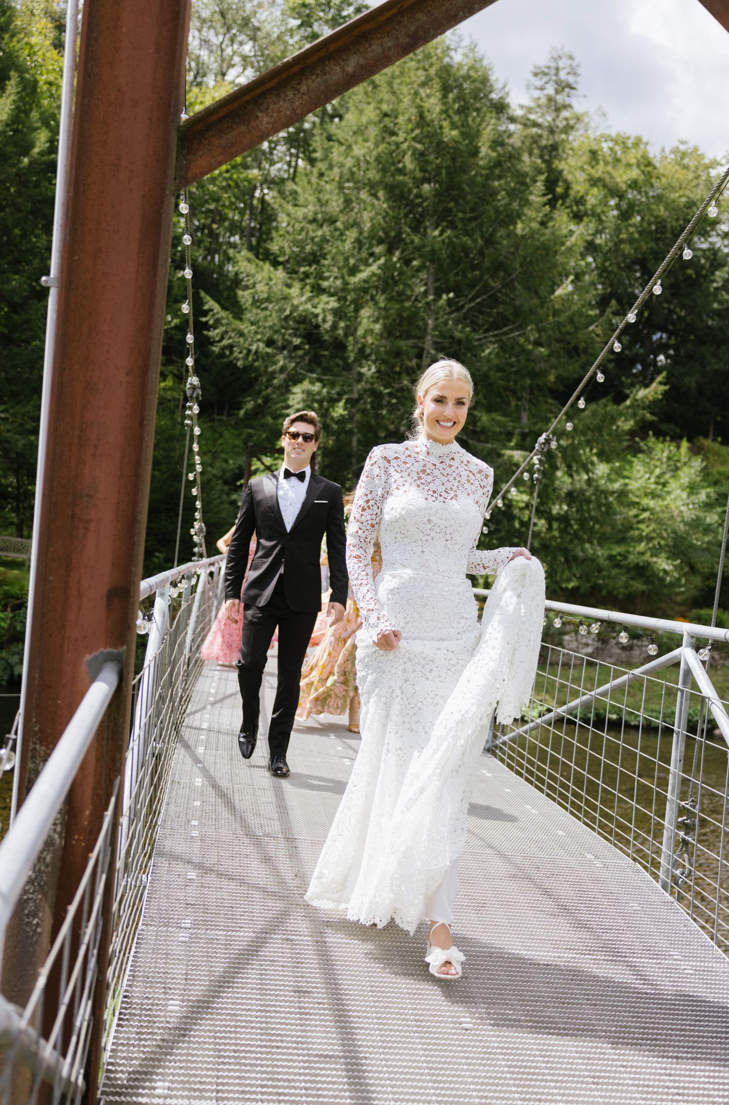 Couple crossing the bridge at Antrim Streamside wedding
