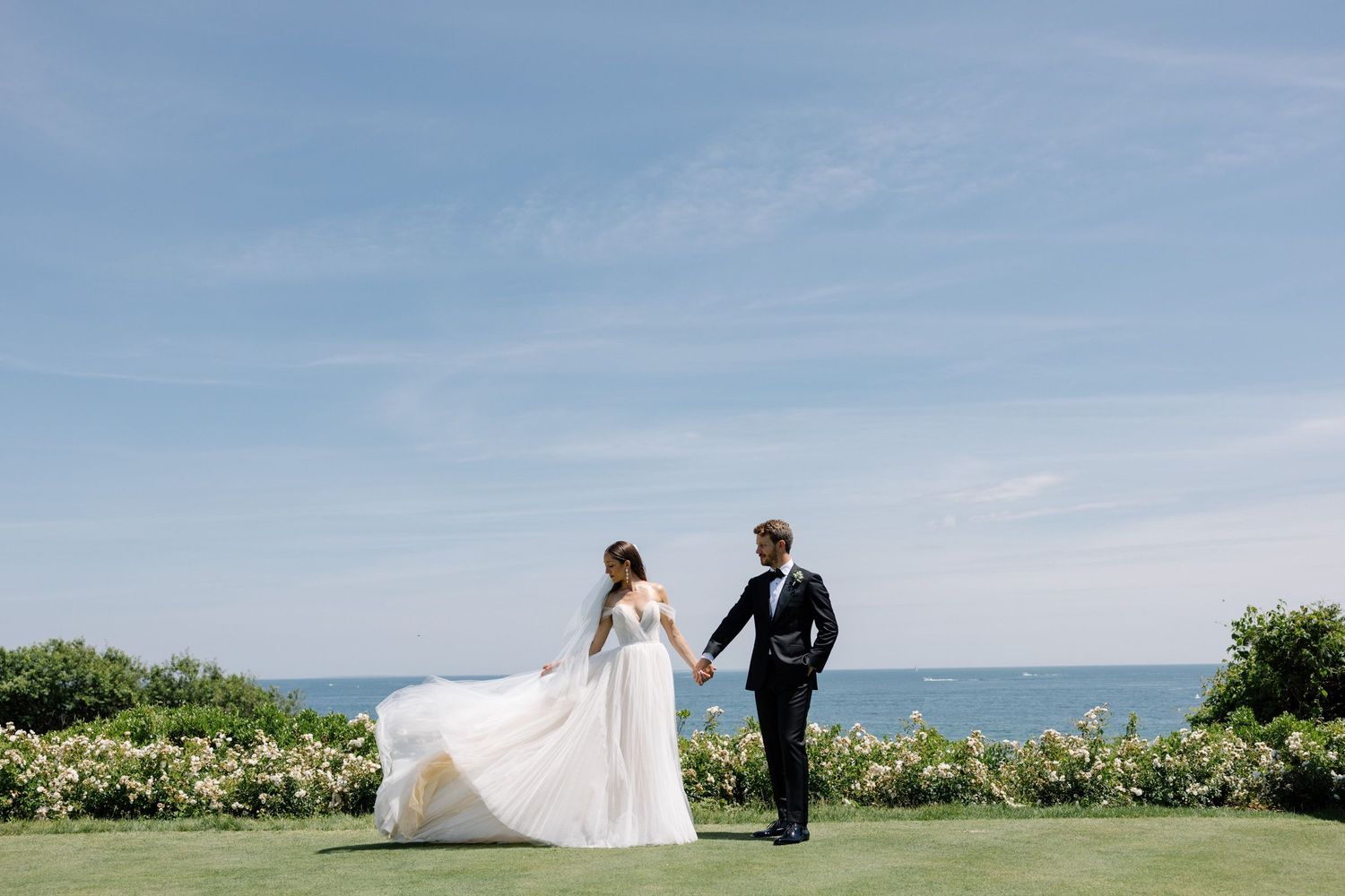 Couple holding hands at Ocean House wedding in Rhode Island