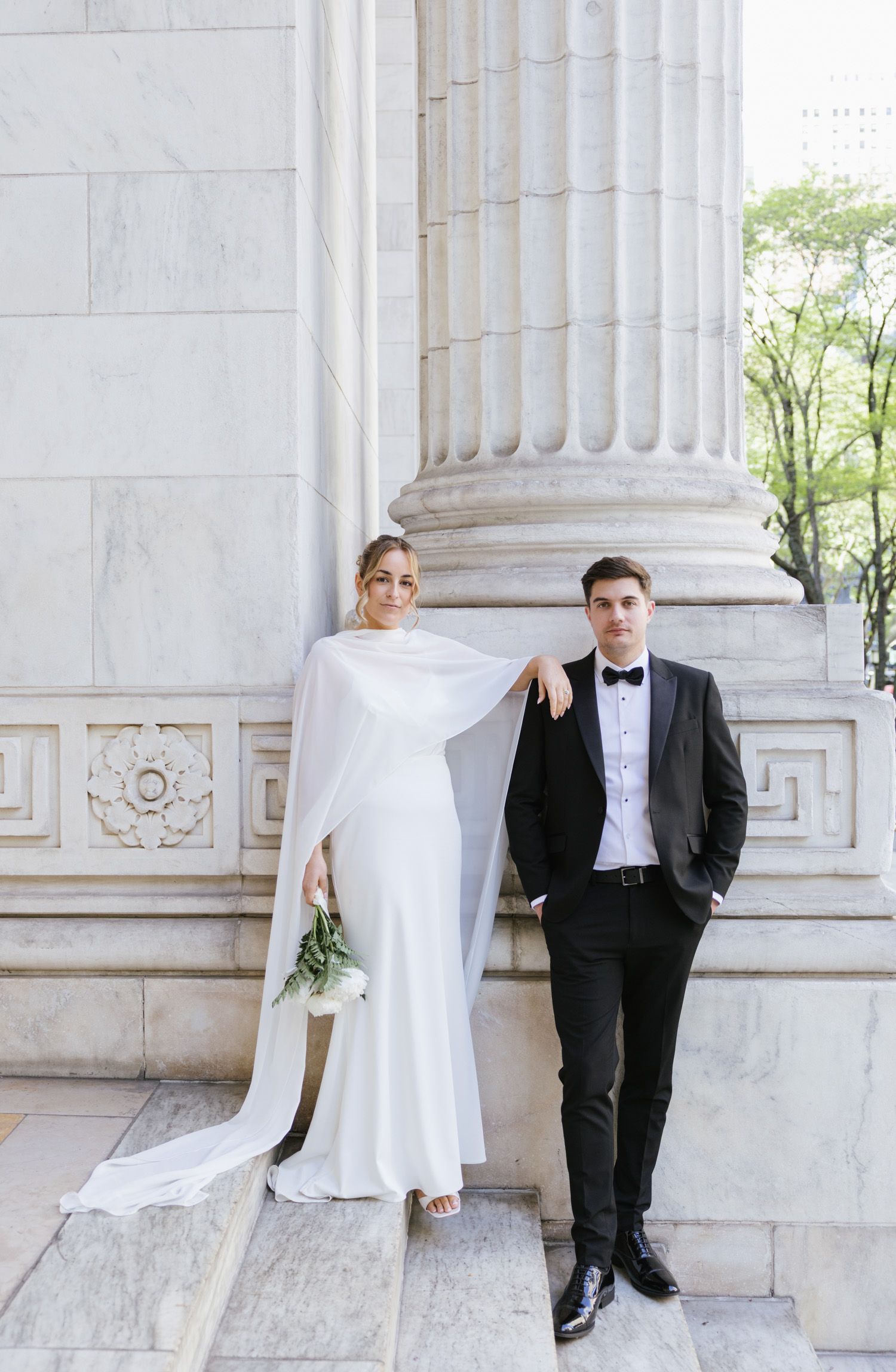 Couple on the steps of the New York Public Library