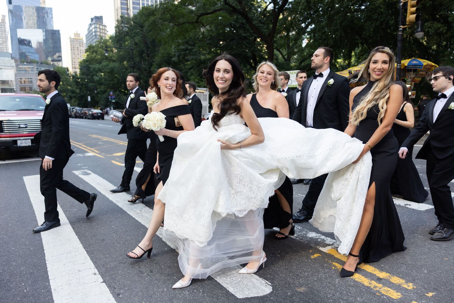 Bride and wedding party crossing the street in NYC