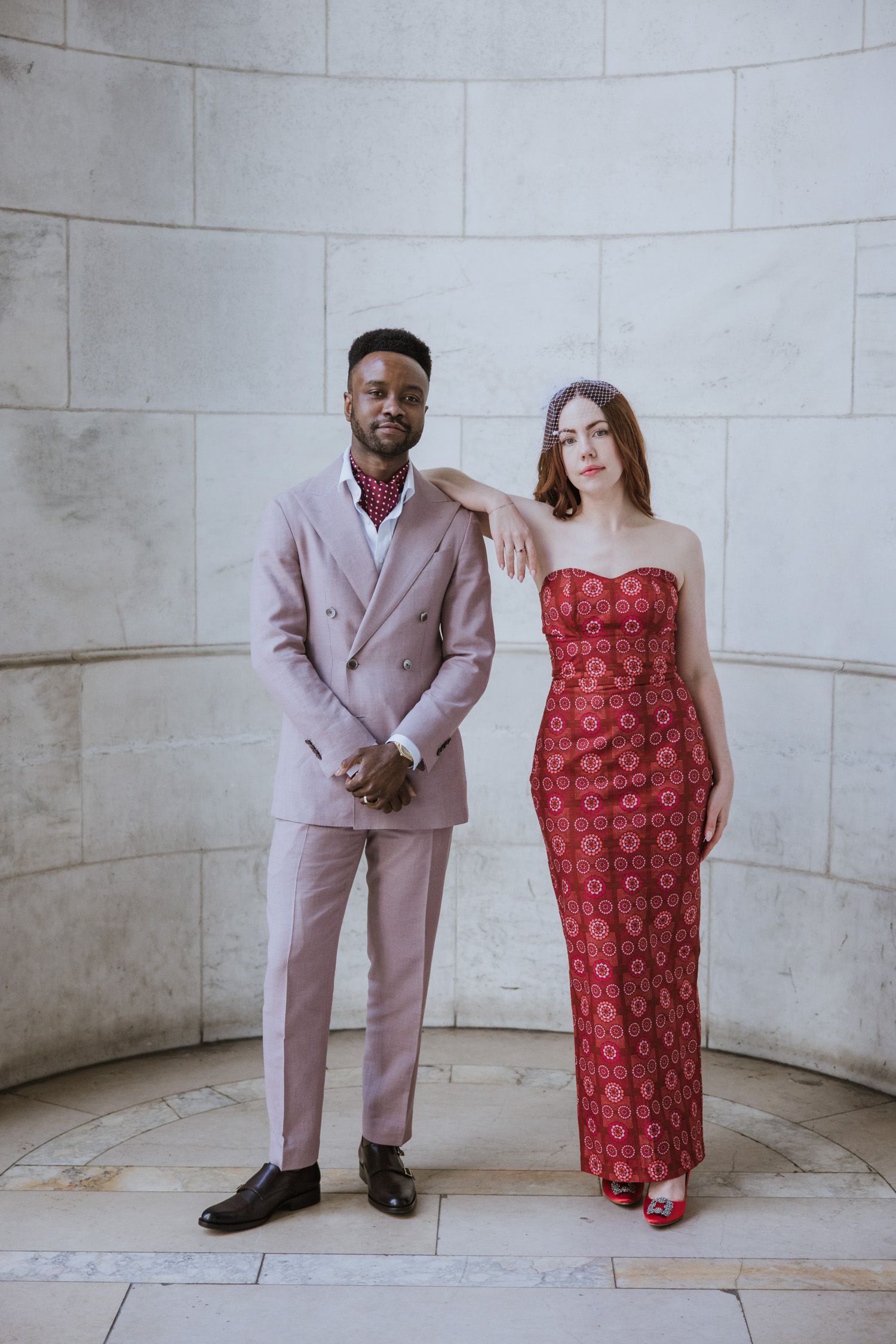 Couple posing for a photo at the New York Public Library in NYC