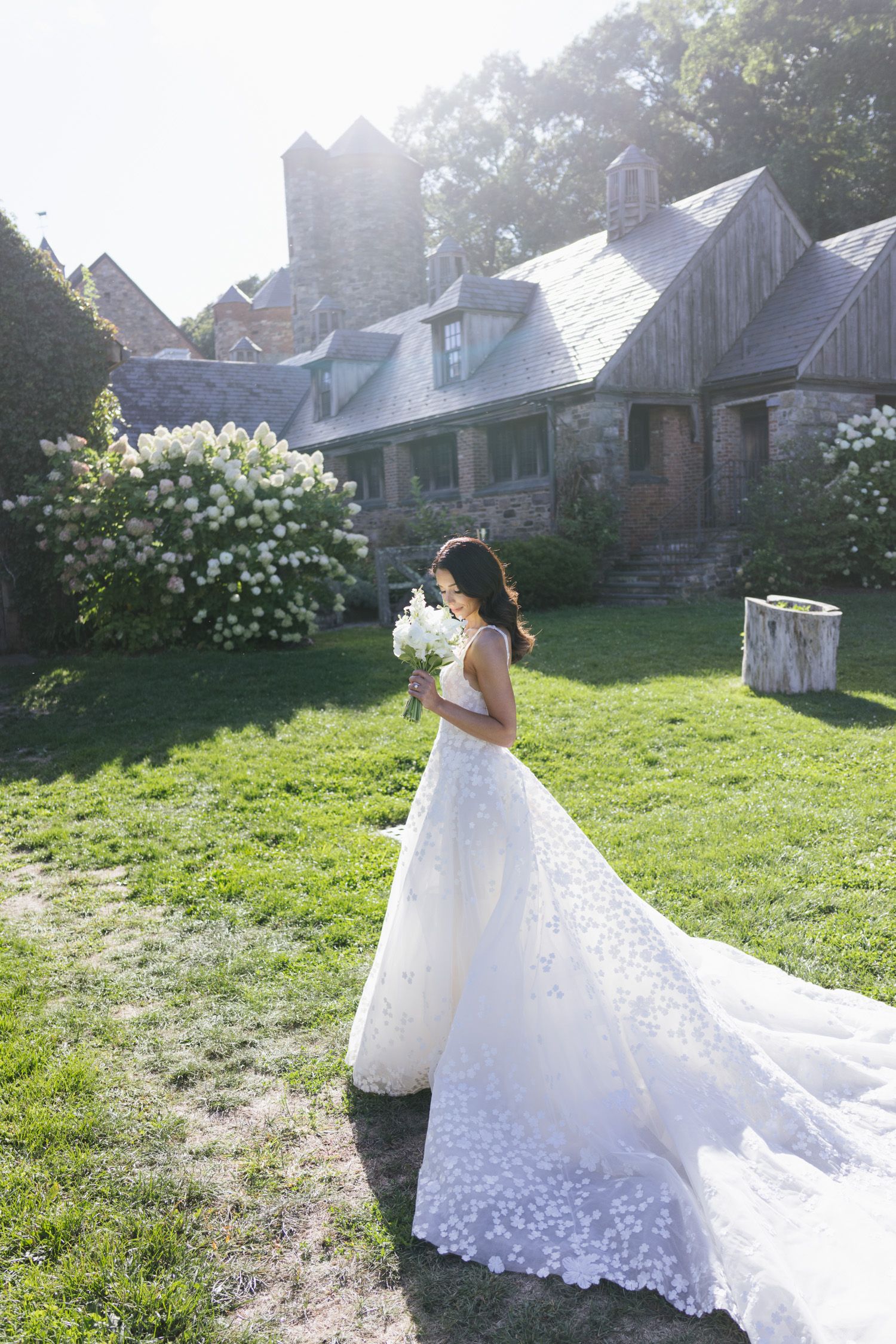 Bride holding a white bouquet at Blue Hill at Stone Barns wedding