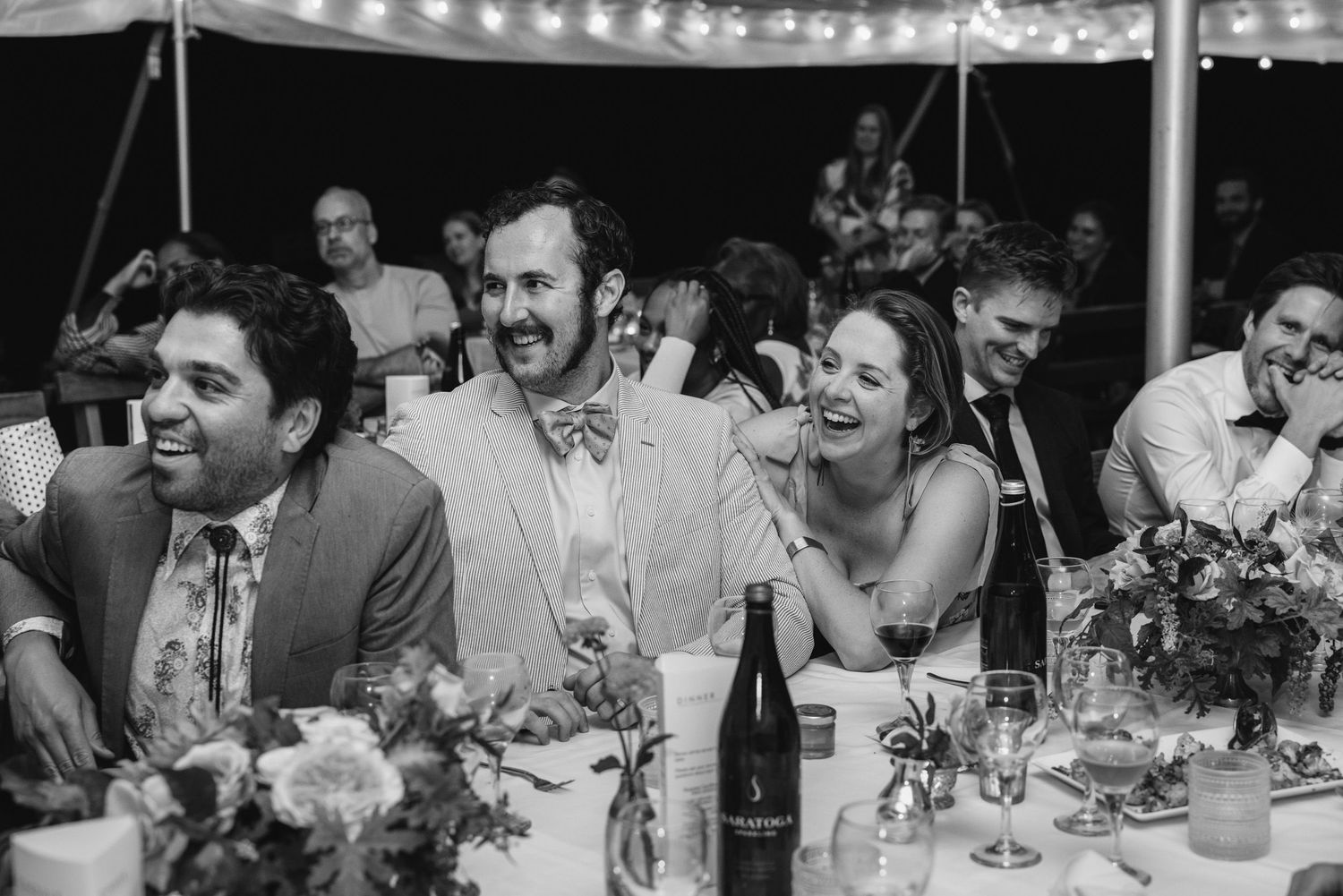 Friends laughing together at Rose Hill Farm wedding