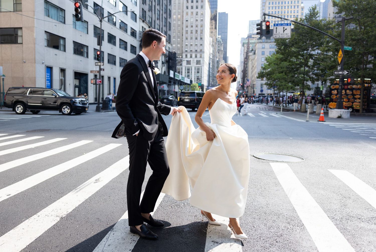 Couple crossing a street near Central Park in NYC