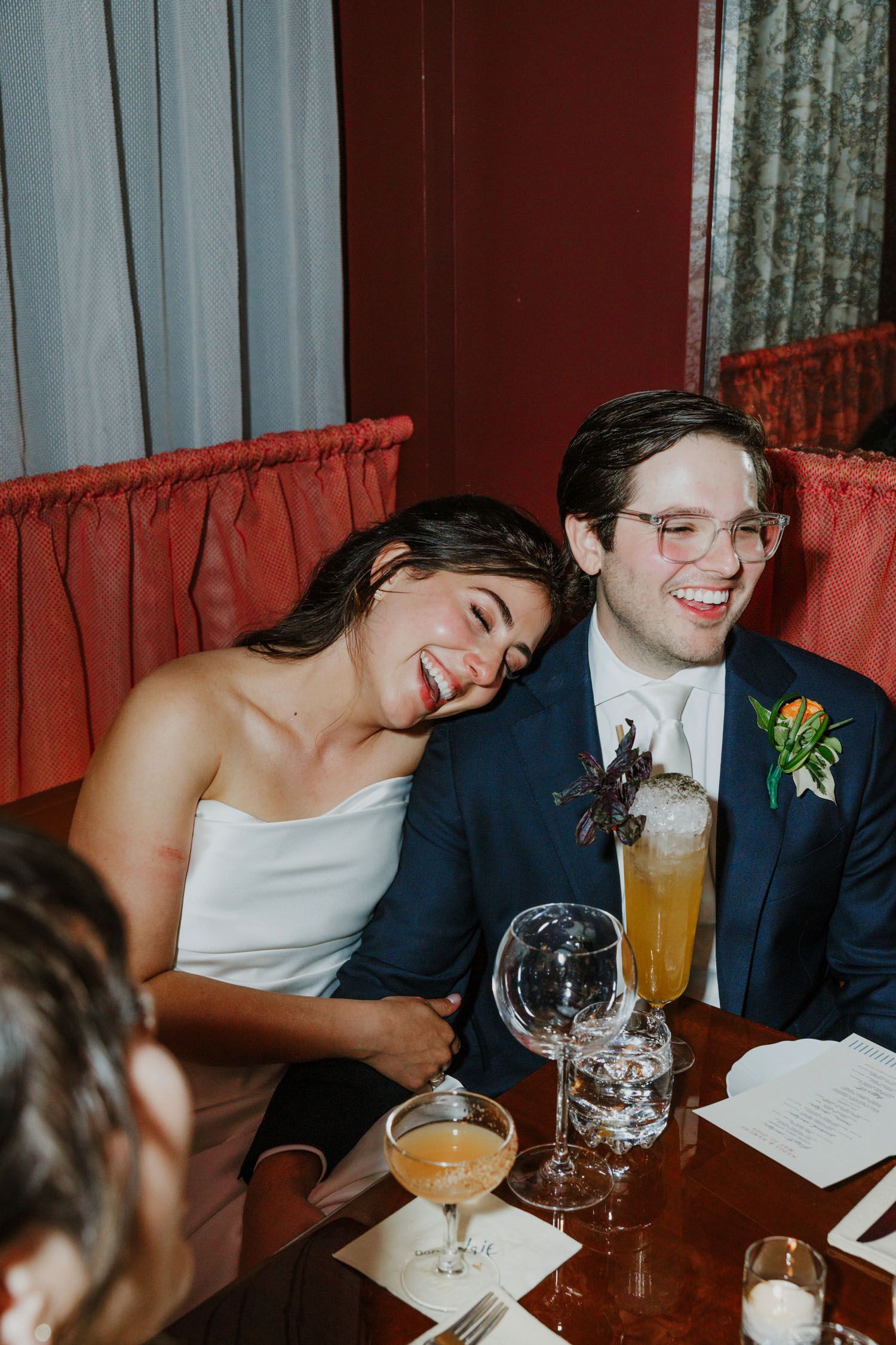 Couple laughing at their reception dinner at Don Angie in NYC