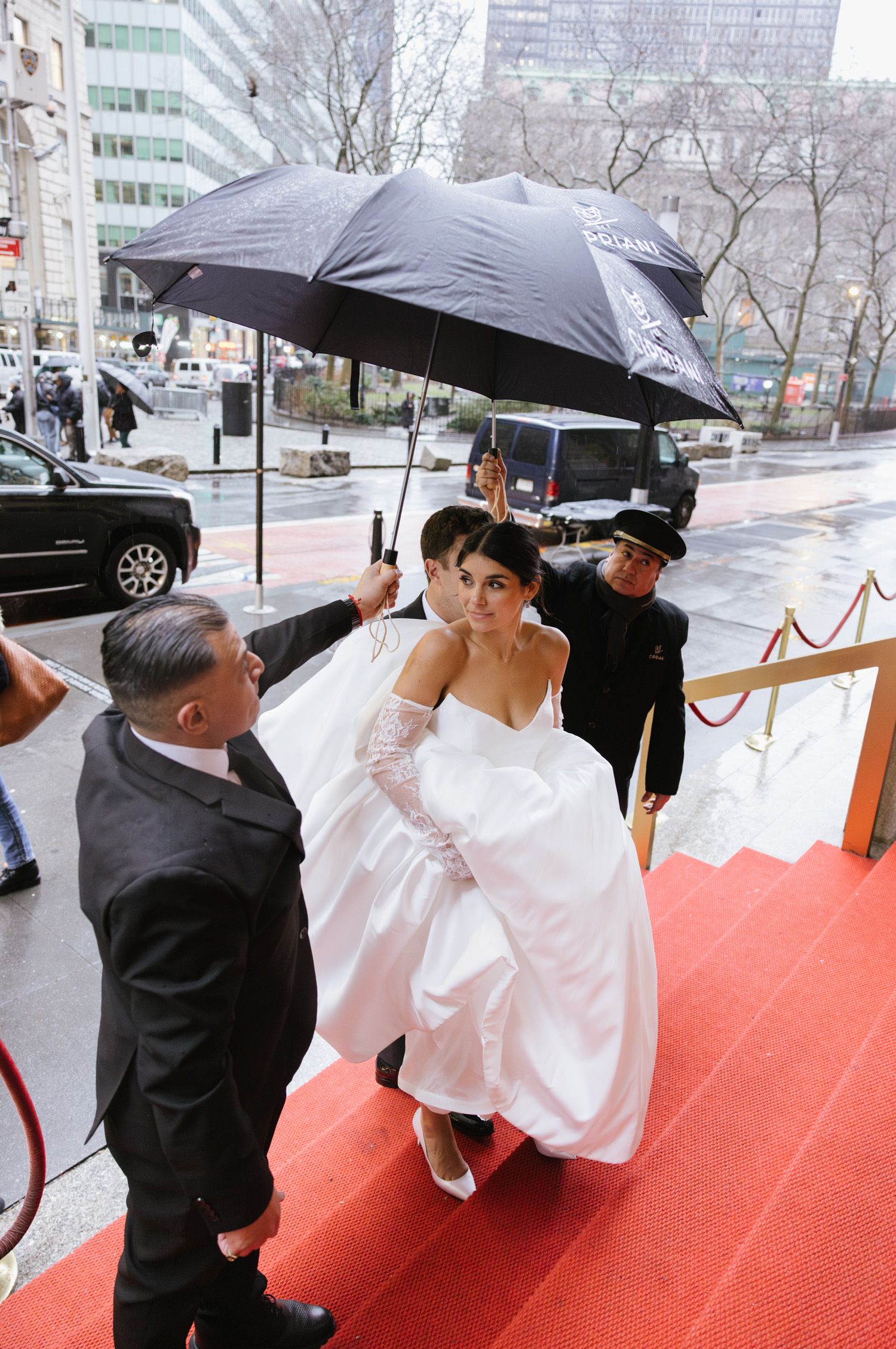Bride walking up steps of Cipriani 25 in NYC