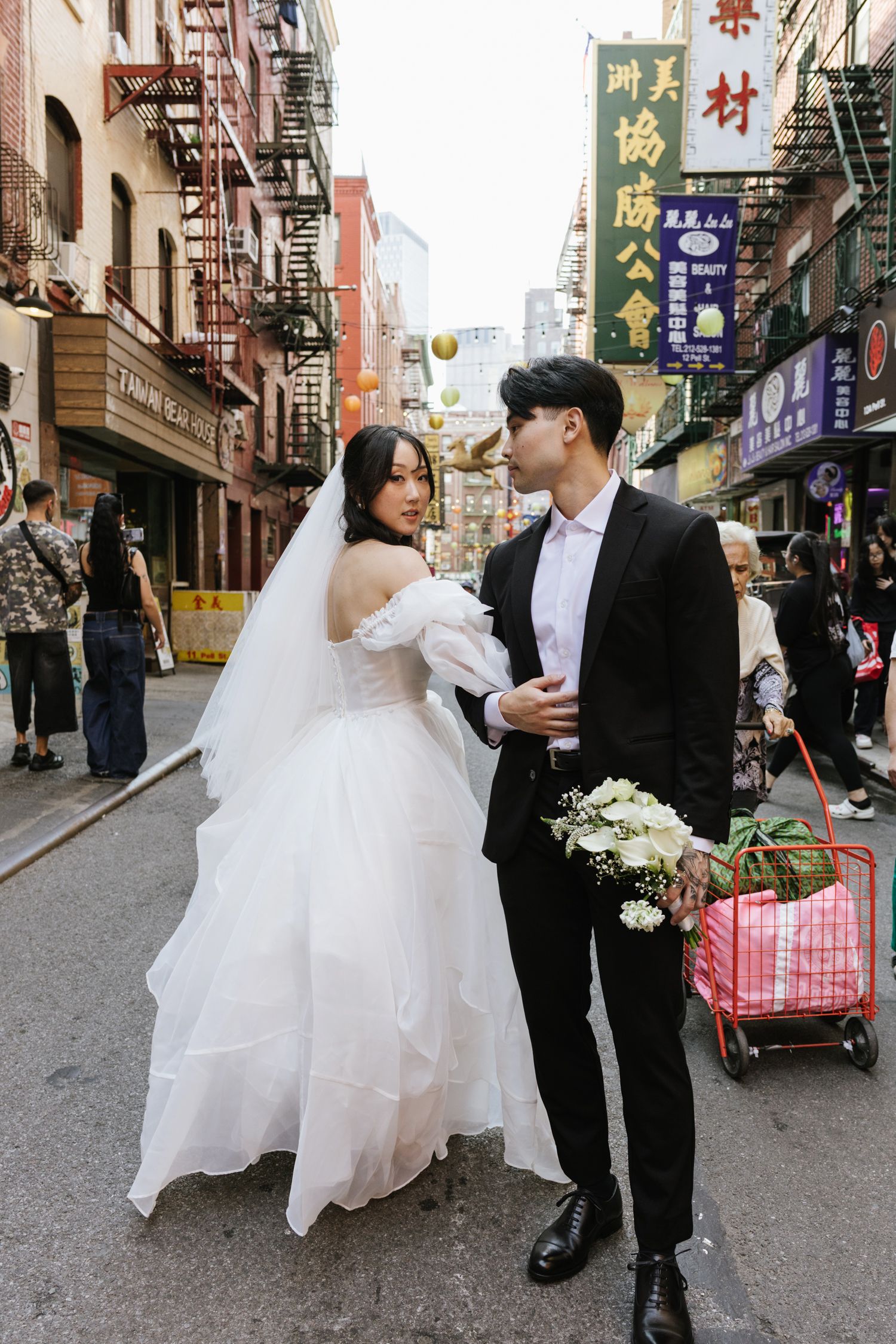 Couple walking in NYC Chinatown
