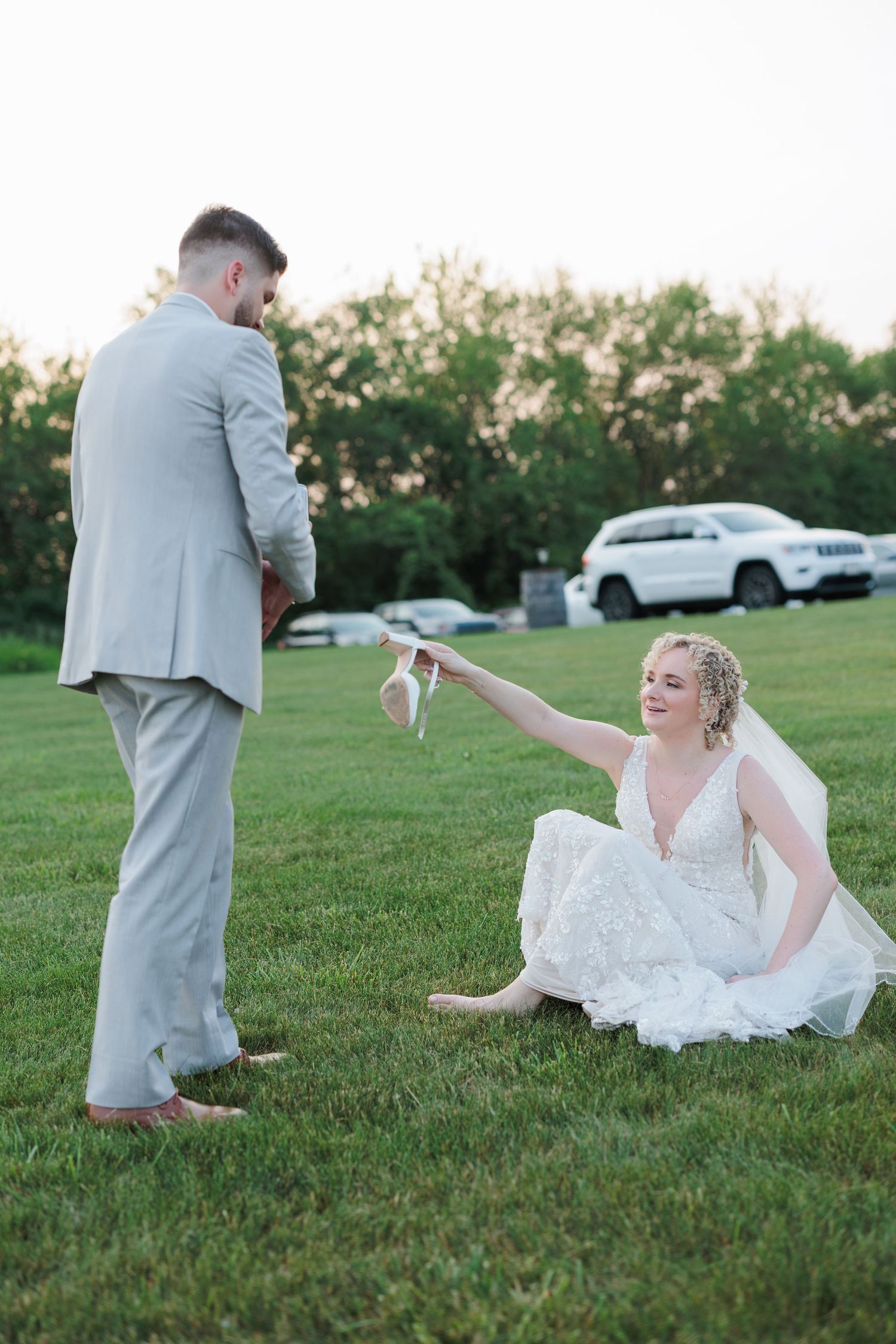 A playful wedding photo sequence showing a couple sitting on grass in formal attire.

Rochester NY wedding photographer