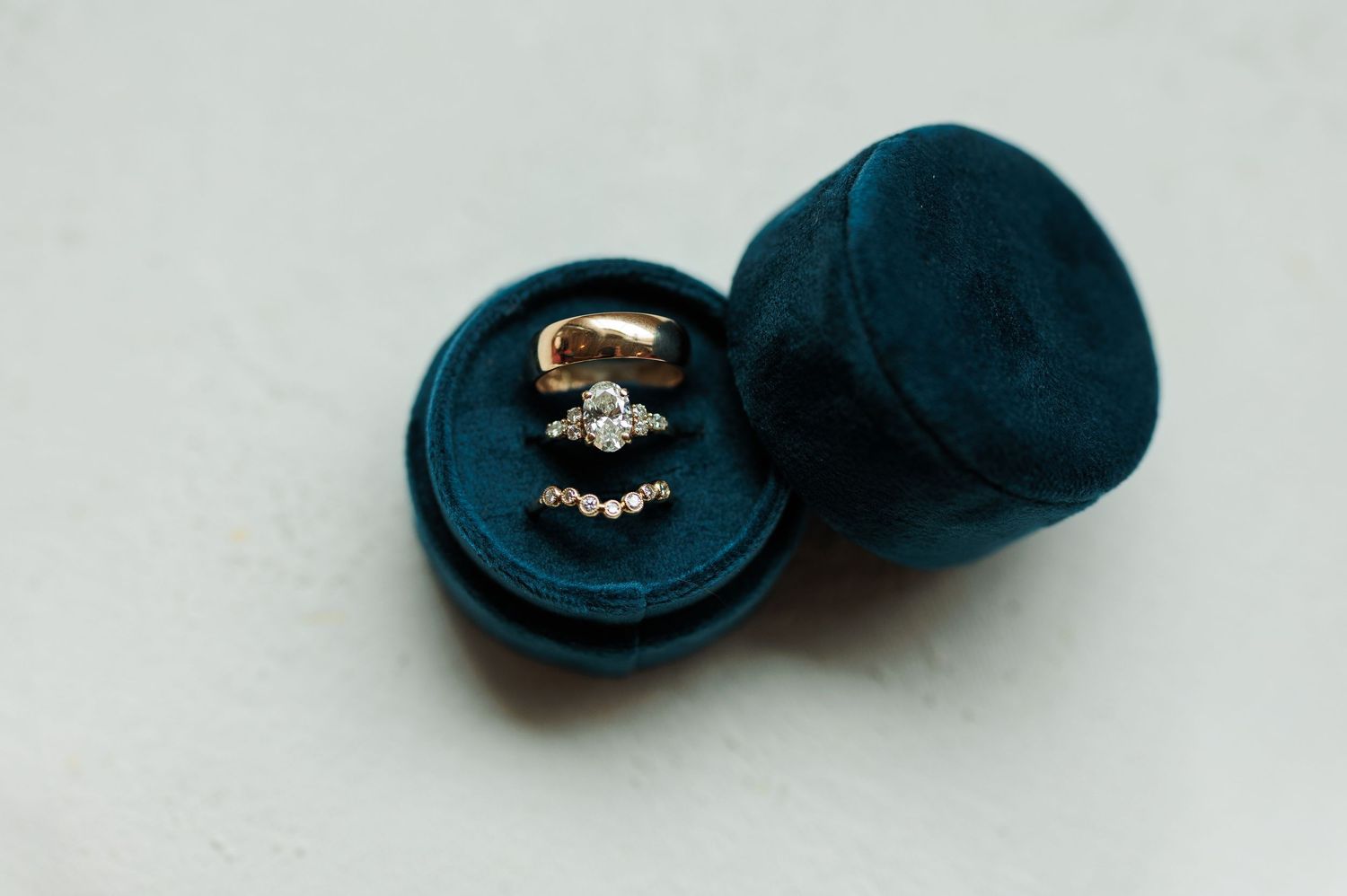Navy blue baseball cap with decorative pin detail shown from multiple angles.
