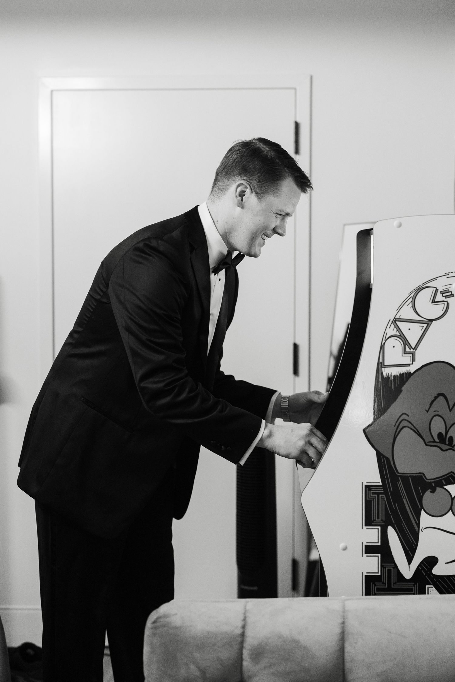 Black and white sequence of someone drawing figures on a wall.