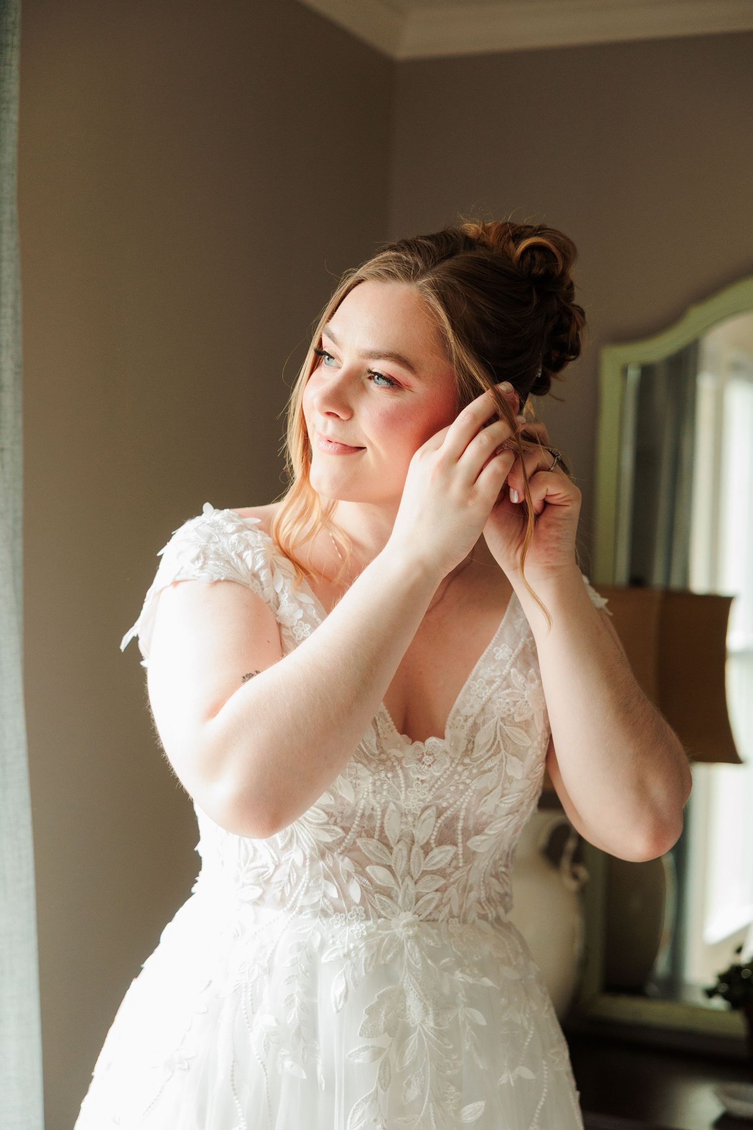 Close-up shots of a bride putting on earrings while getting ready for her wedding day.