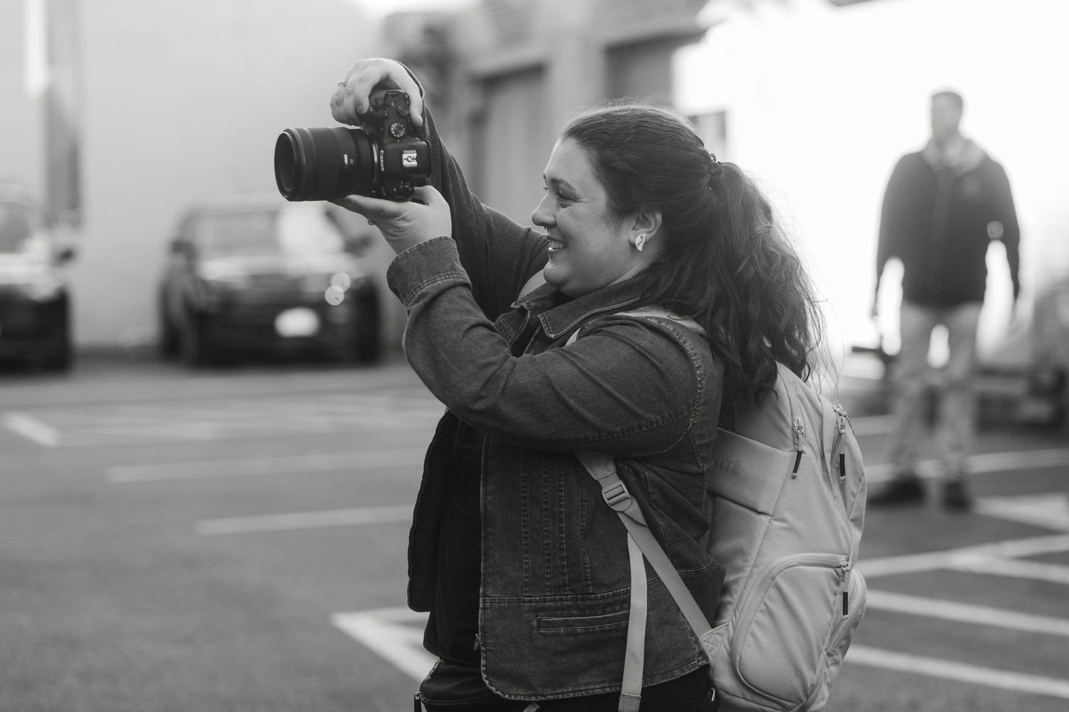 Black and white candid wedding photography moments captured outdoors.