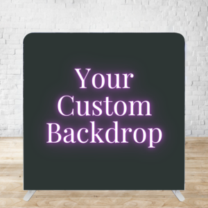 Custom backdrop display stand with glowing purple text against a dark background on wooden floor.