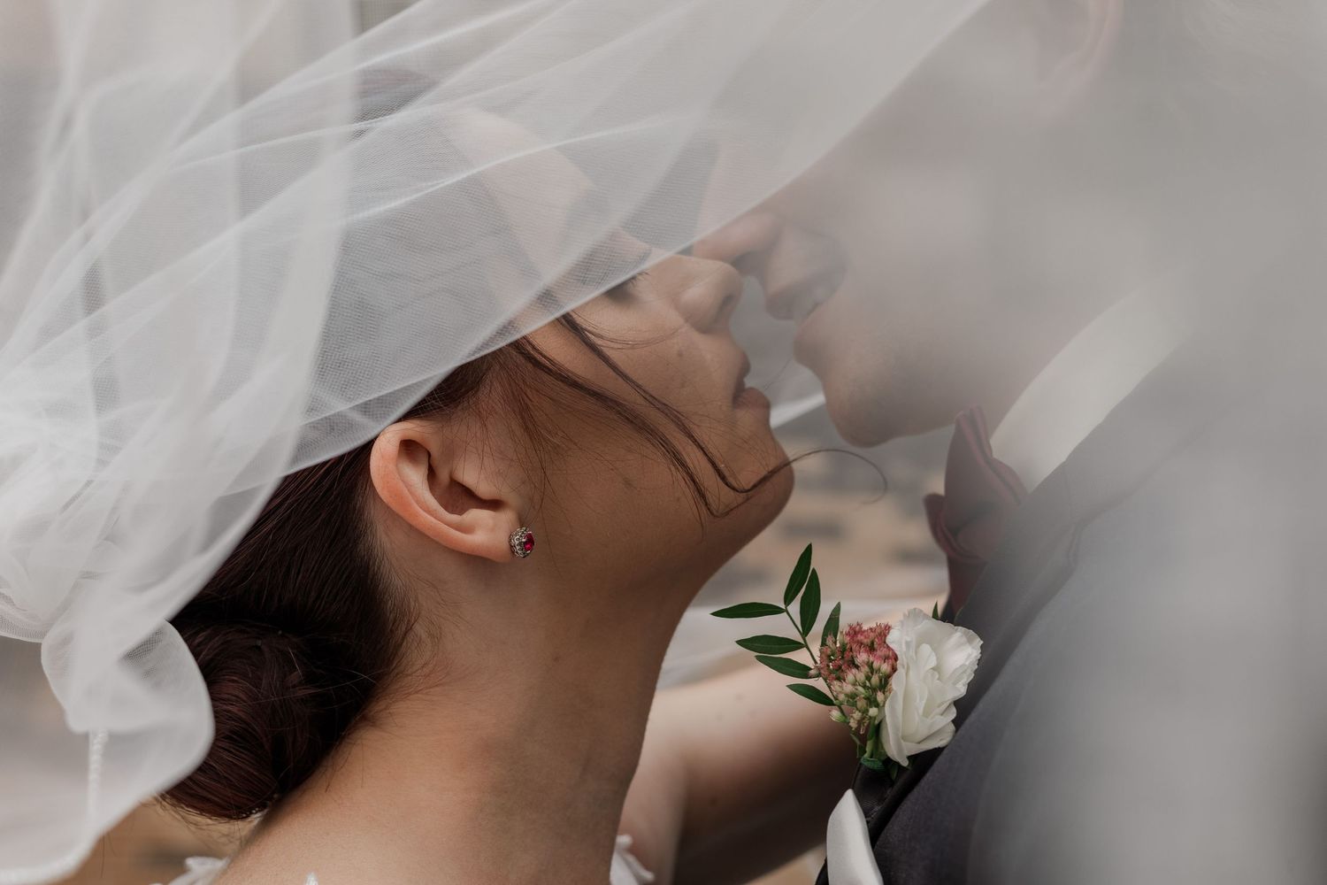 Close up of a couple on their wedding day under the veil in Kitchener, Ontario